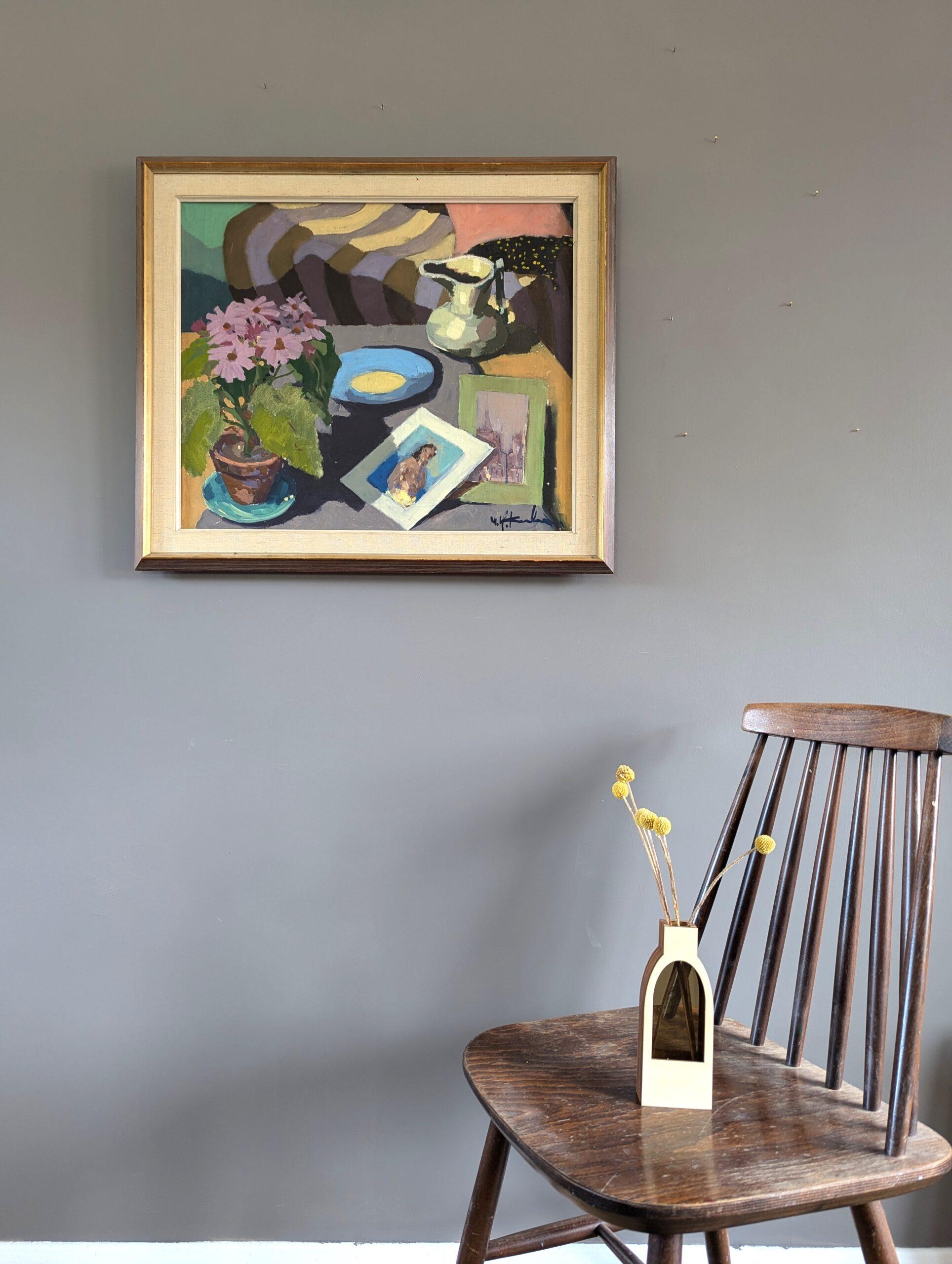 QUIET MOMENTS
Oil on Canvas
Size: 57 x 66 cm (including frame)

A delightful mid-century modernist style interior still life composition, executed in oil onto canvas.

The scene unfolds with a table setting, where an array of objects have been