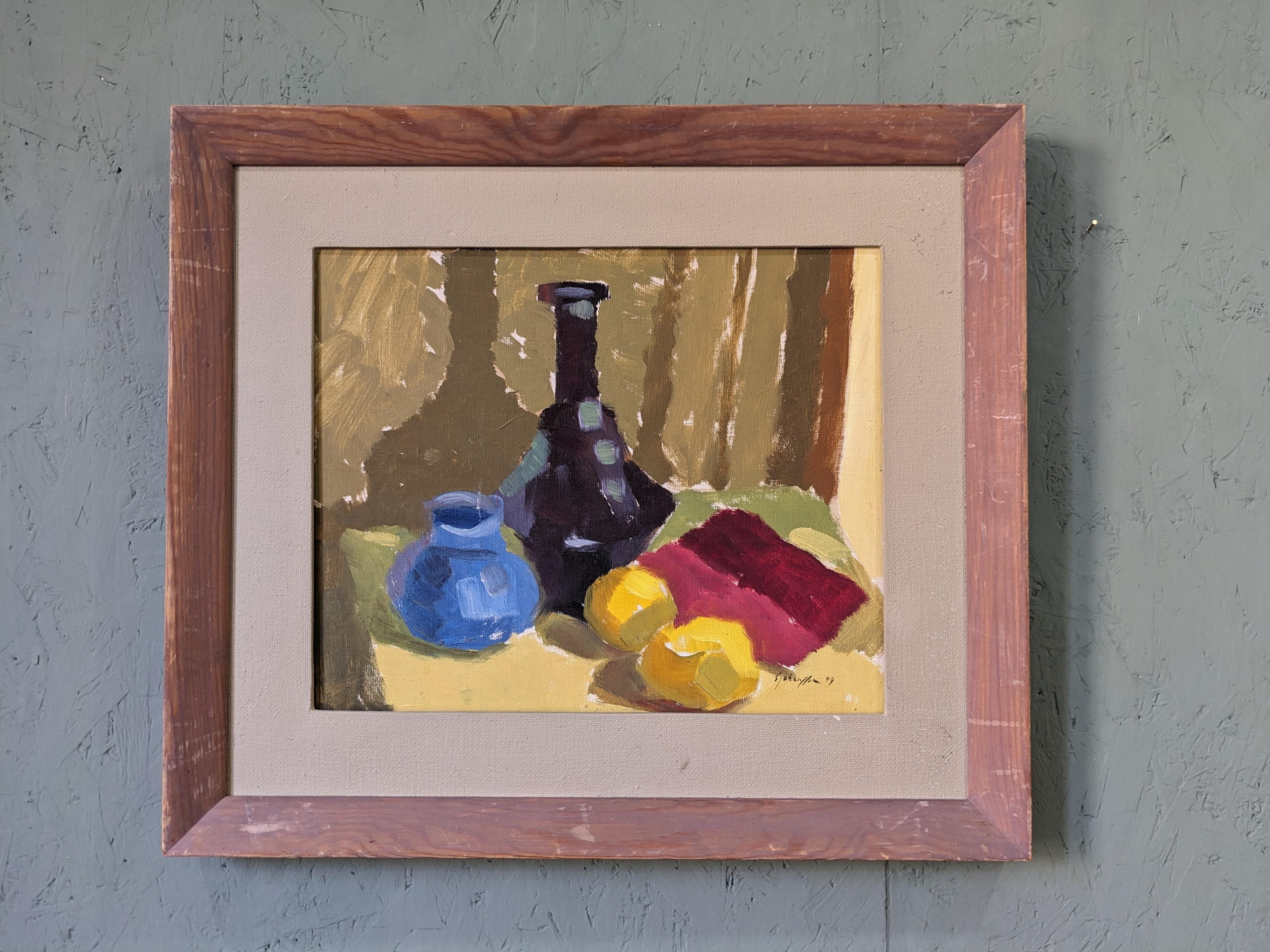 LEMONS & POTS
Oil on Board
Size: 48.5 x 55.5 cm (including frame)

A visually striking and expressive modernist still life composition, executed in oil onto board and dated 1949.

The painting presents a group of objects including 2 lemons, 2 pots