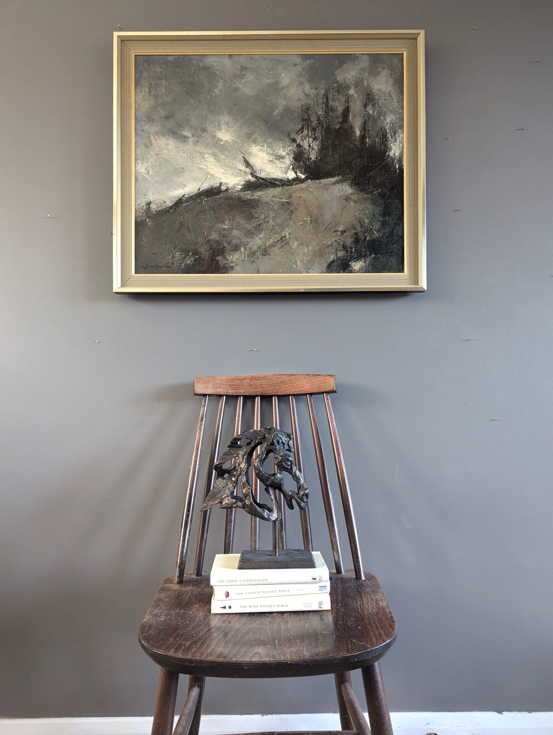 STORM'S EDGE
Size: 58 x 68.5 cm (including frame)
Oil on canvas

A moody and atmospheric mid-century landscape composition, painted in oil onto canvas.

The subject matter appears to depict a windswept, desolate hillside with a cluster of trees