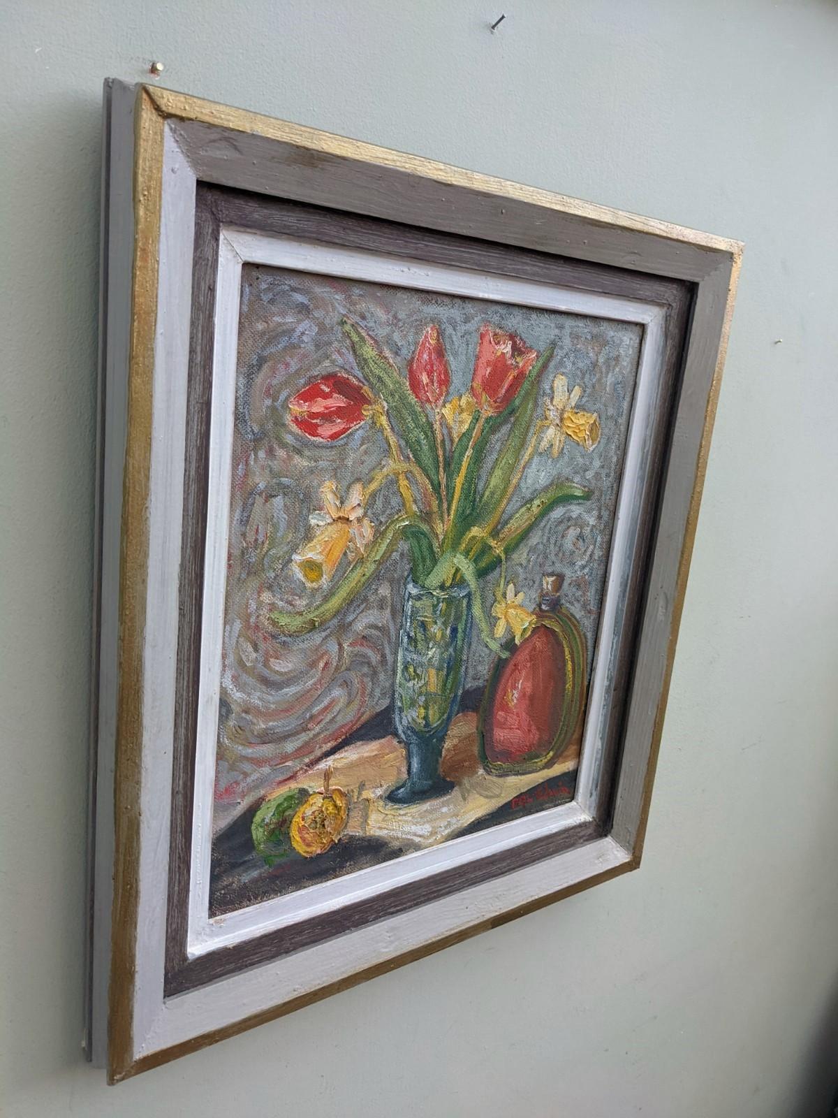 Still Life with Tulips
Size: 51 x 46 cm (including frame)
Oil on board

A vibrant and uplifting mid-century still life composition, painted in oil onto board.

On a table top sit a group of objects including some fruit,  tulips and daffodils in a