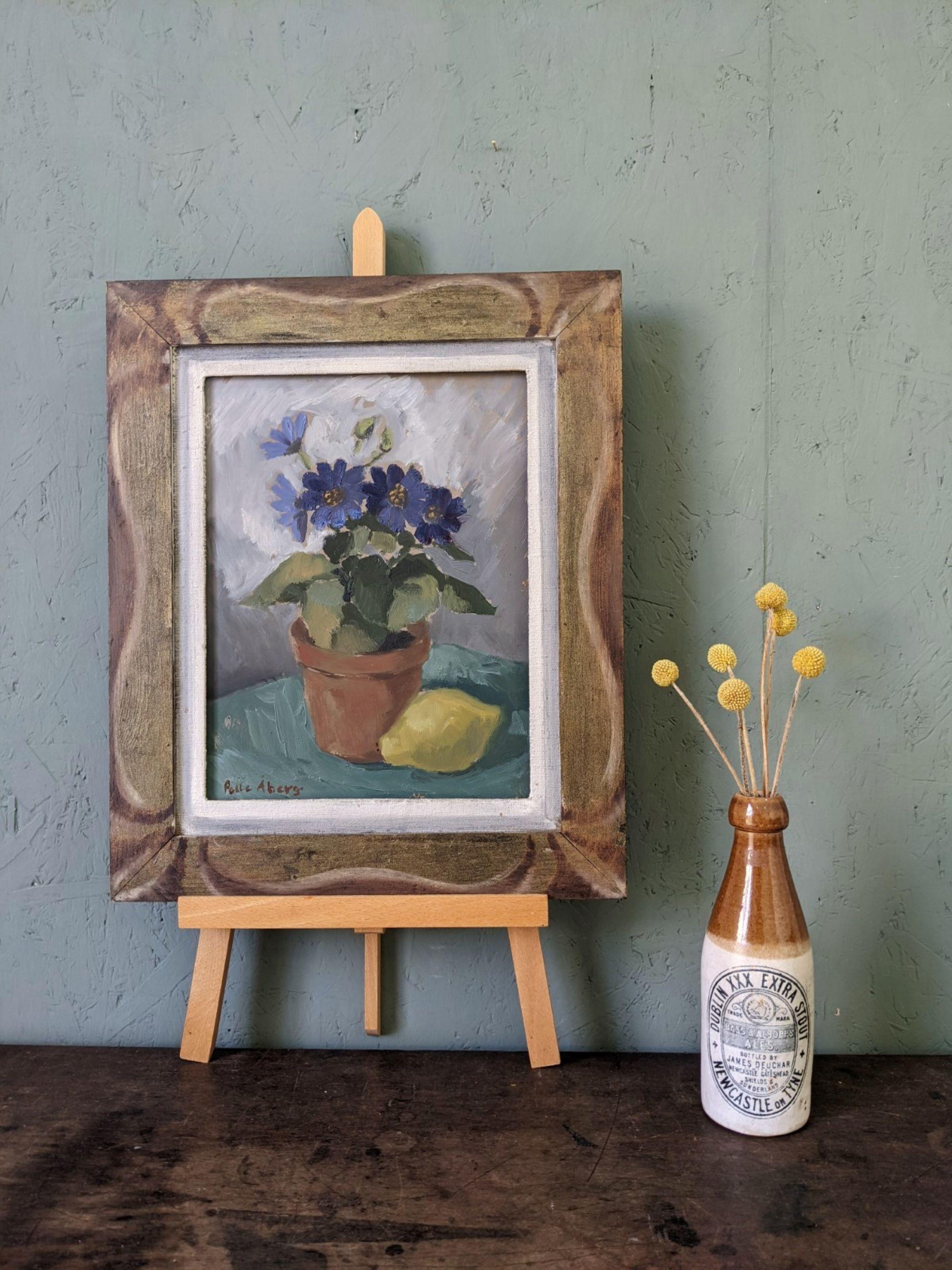 PURPLE FLOWERS
Size: 42 x 35 cm (including frame)
Oil on board

An elegant and alluring mid-century still life composition, executed in oil onto board.

Set against a soft greyish-white background, a charming arrangement takes centre stage featuring
