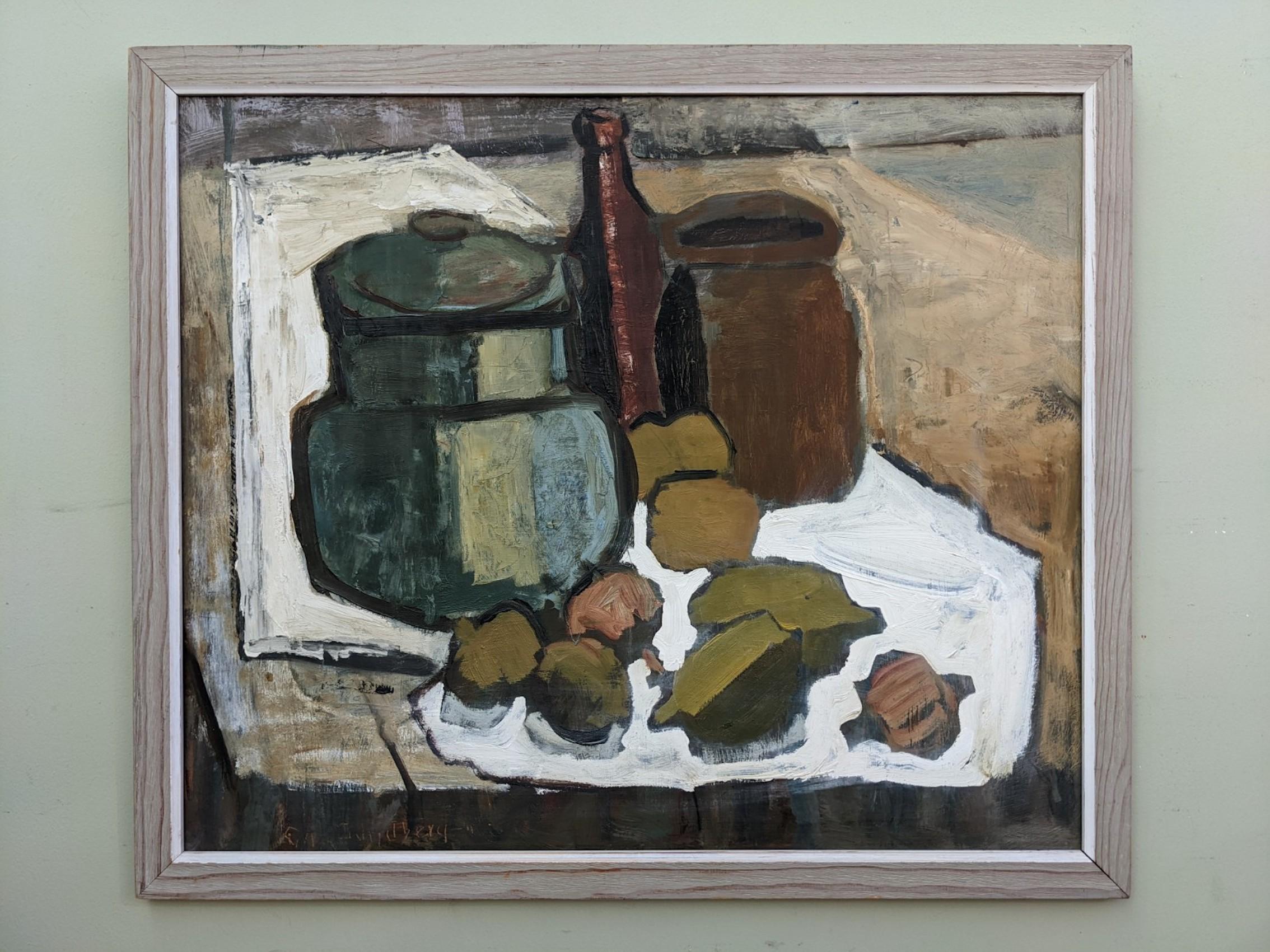 EARTHENWARE
Oil on Board
Size: 54.5 x 64 cm (including frame)

A bold and very striking mid century modernist still life composition, executed in oil onto board.

A group of objects including 2 jars, a bottle, and an assortment of fruit punctuate