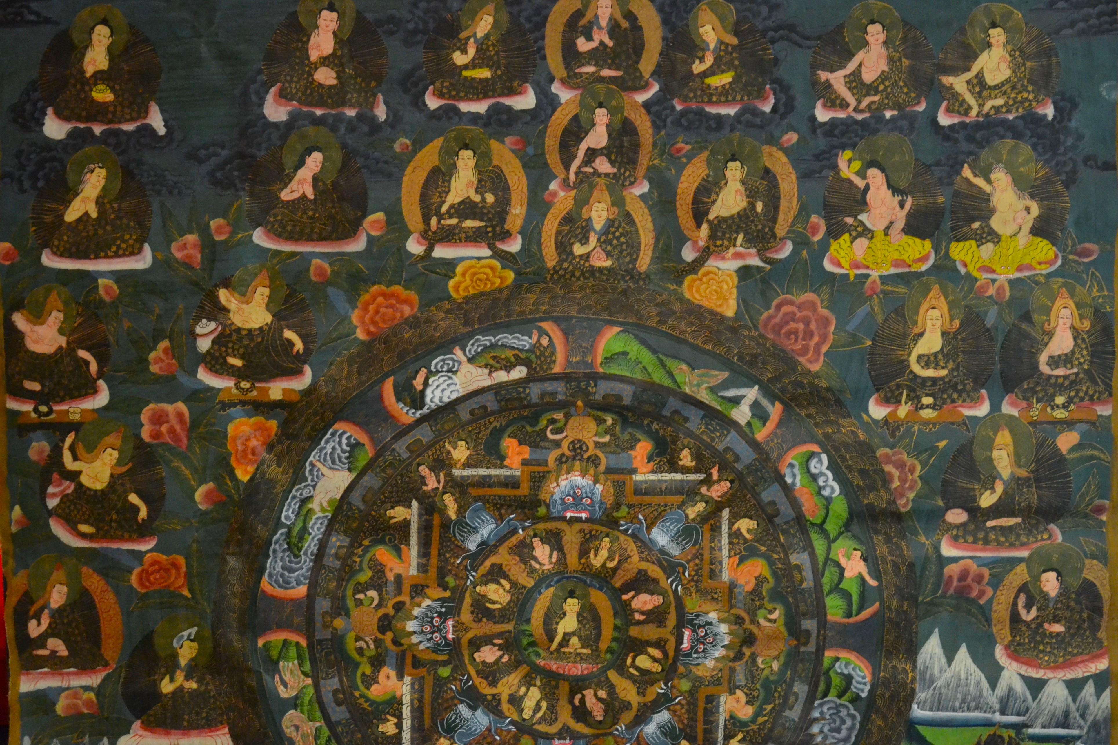 Decorative Thangka is an original colored artwork realized in Nepal in the XX century.

Gouache on line.

This beautiful artwork represents a central mandala flanked by numerous bodhisattvas in a stylized landscape.

Good conditions except for