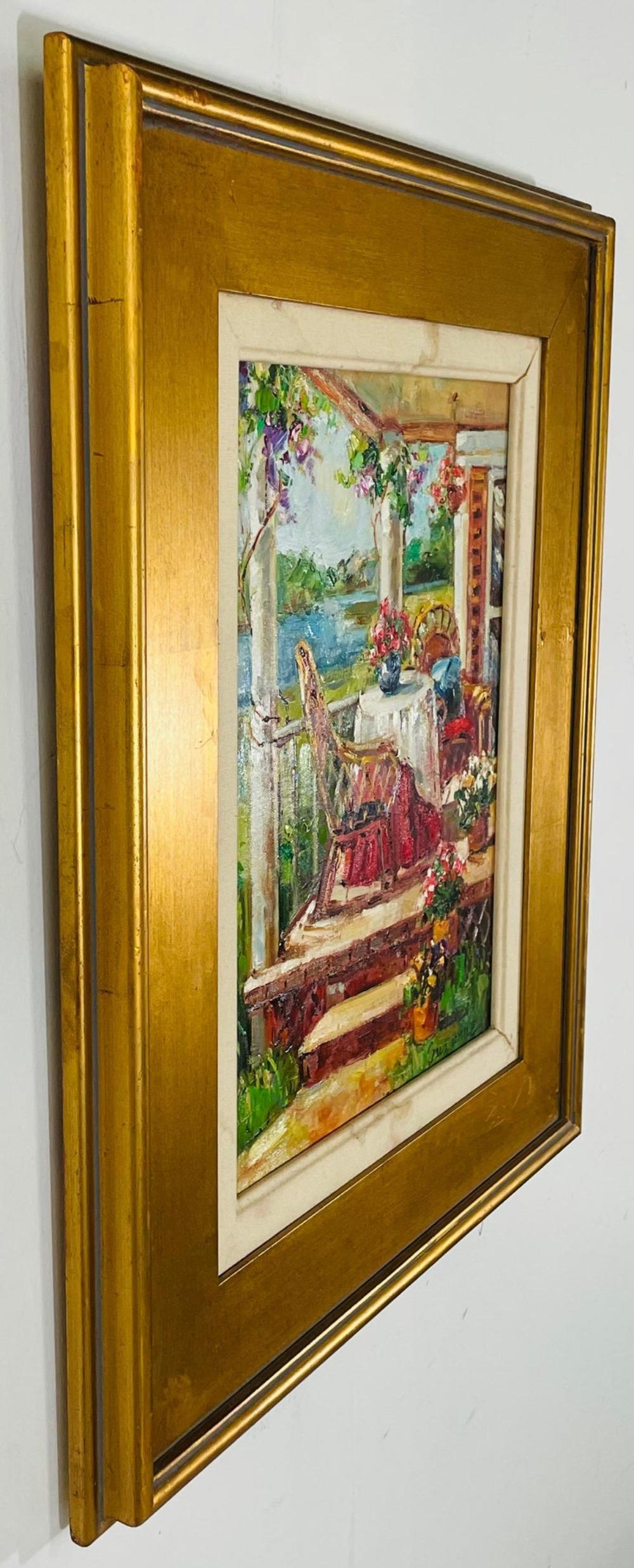 An 1980's gorgeous oil on canvas painting of a home porch. The painting depicting a view of an elegant country home deck by the lack. This beautiful painting is finely presented in a gilt custom frame and is signed Botton right by the artist
