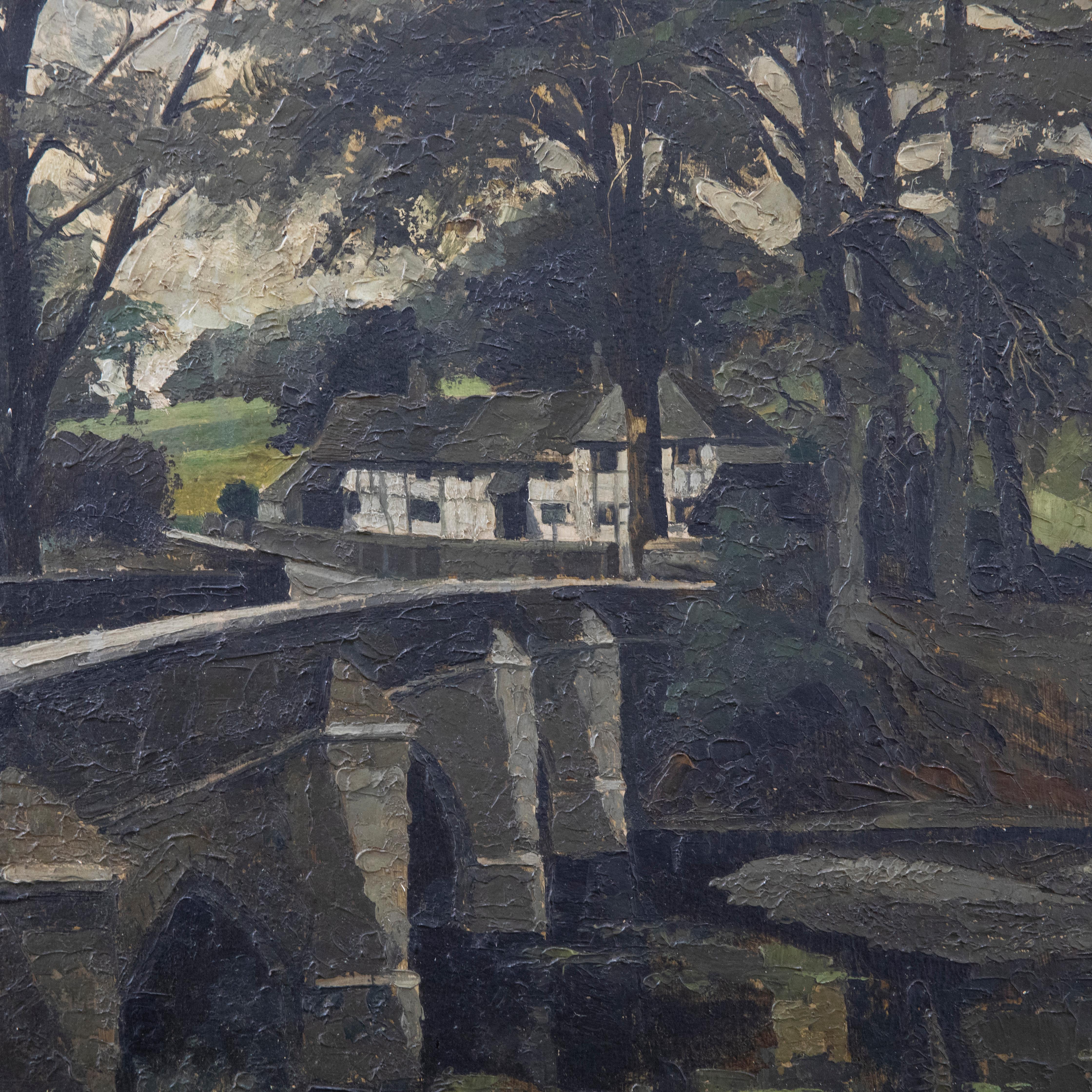 A charming mid century oil depicting a Tudor cottage nestled between towering trees. the artist takes the viewers eyeline over a curving bridge, following the path down to the 15th century house. Signed and dated to the lower left. Presented in a