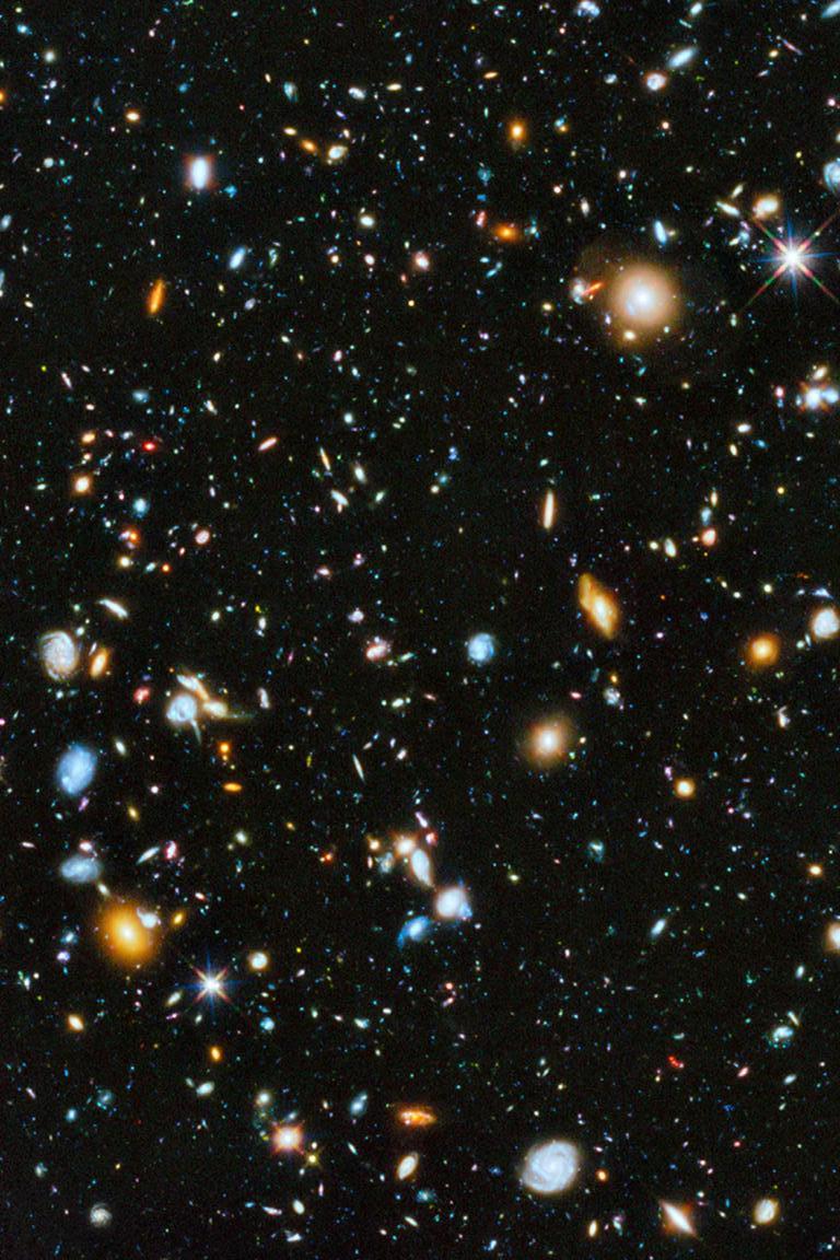 Original museum grade exhibition prints on acid-free archival luster paper.

These are the highest quality NASA prints ever produced. 

Embedded in this Hubble Space Telescope image of nearby and distant galaxies are 18 young galaxies or galactic
