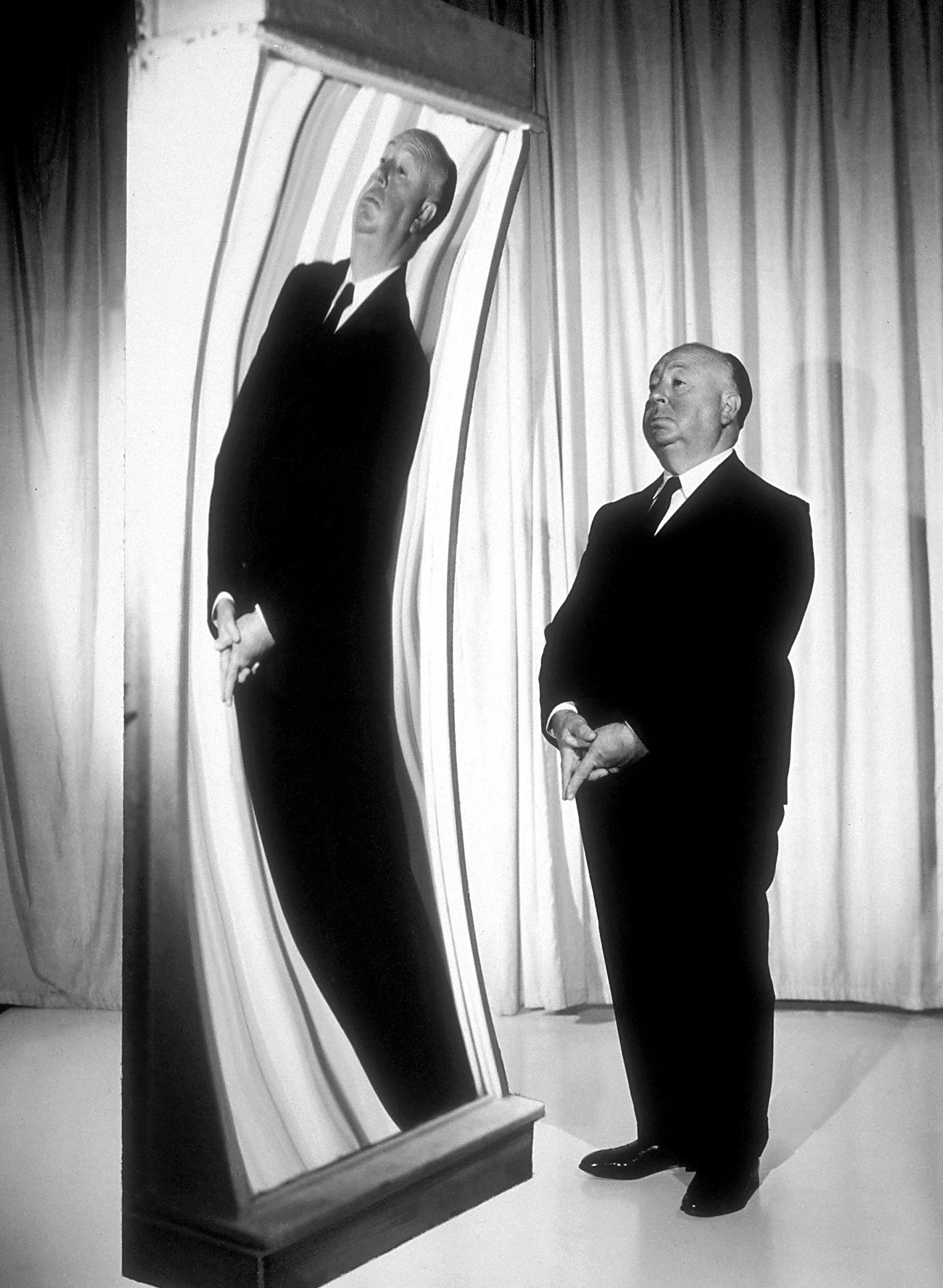 Unknown Black and White Photograph - Alfred Hitchcock in Funhouse Mirror Globe Photos Fine Art Print