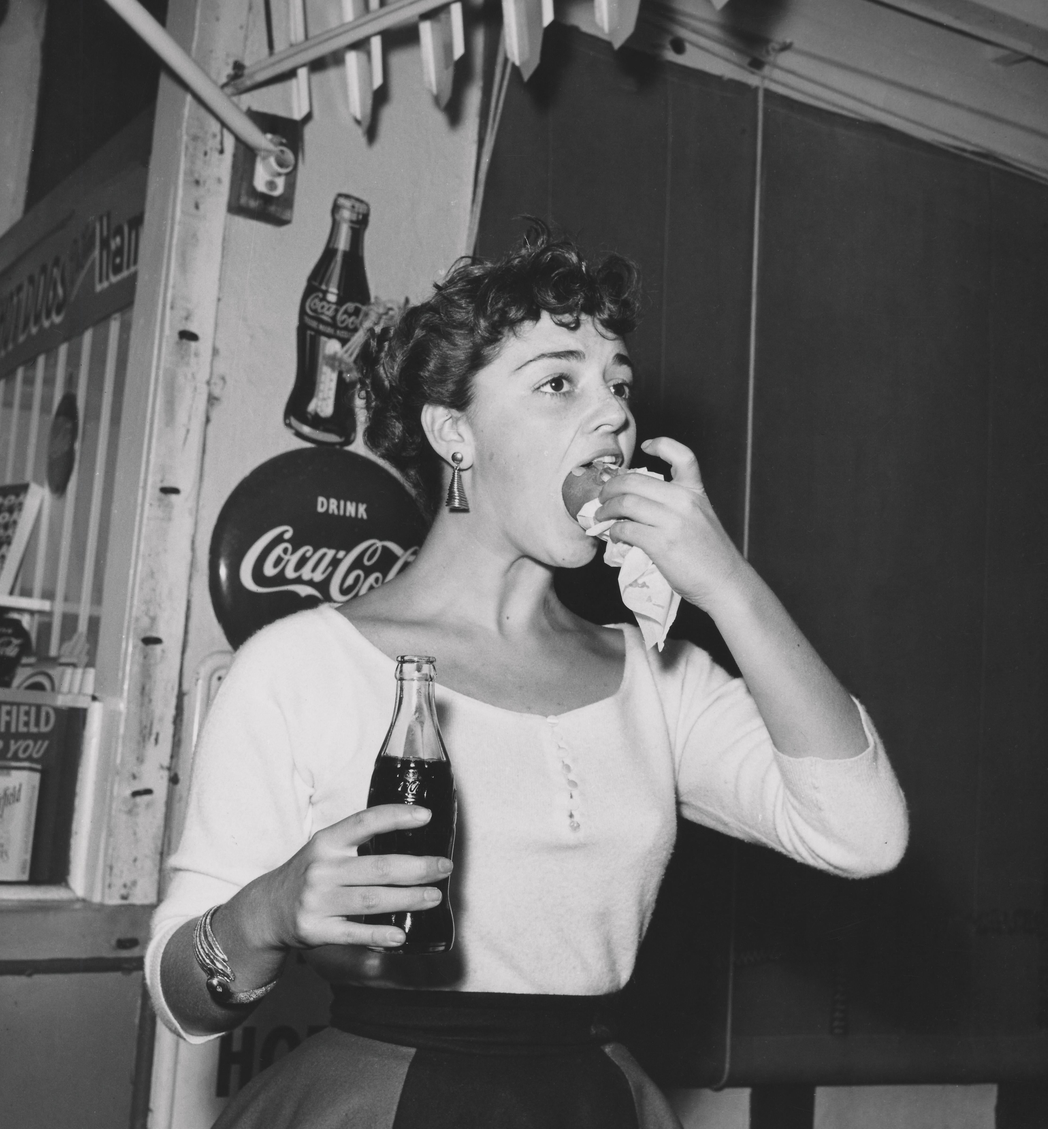 Unknown Black and White Photograph - Anna Marie Alberghetti: Opera Star with Coca Cola and a Hot Dog Fine Art Print