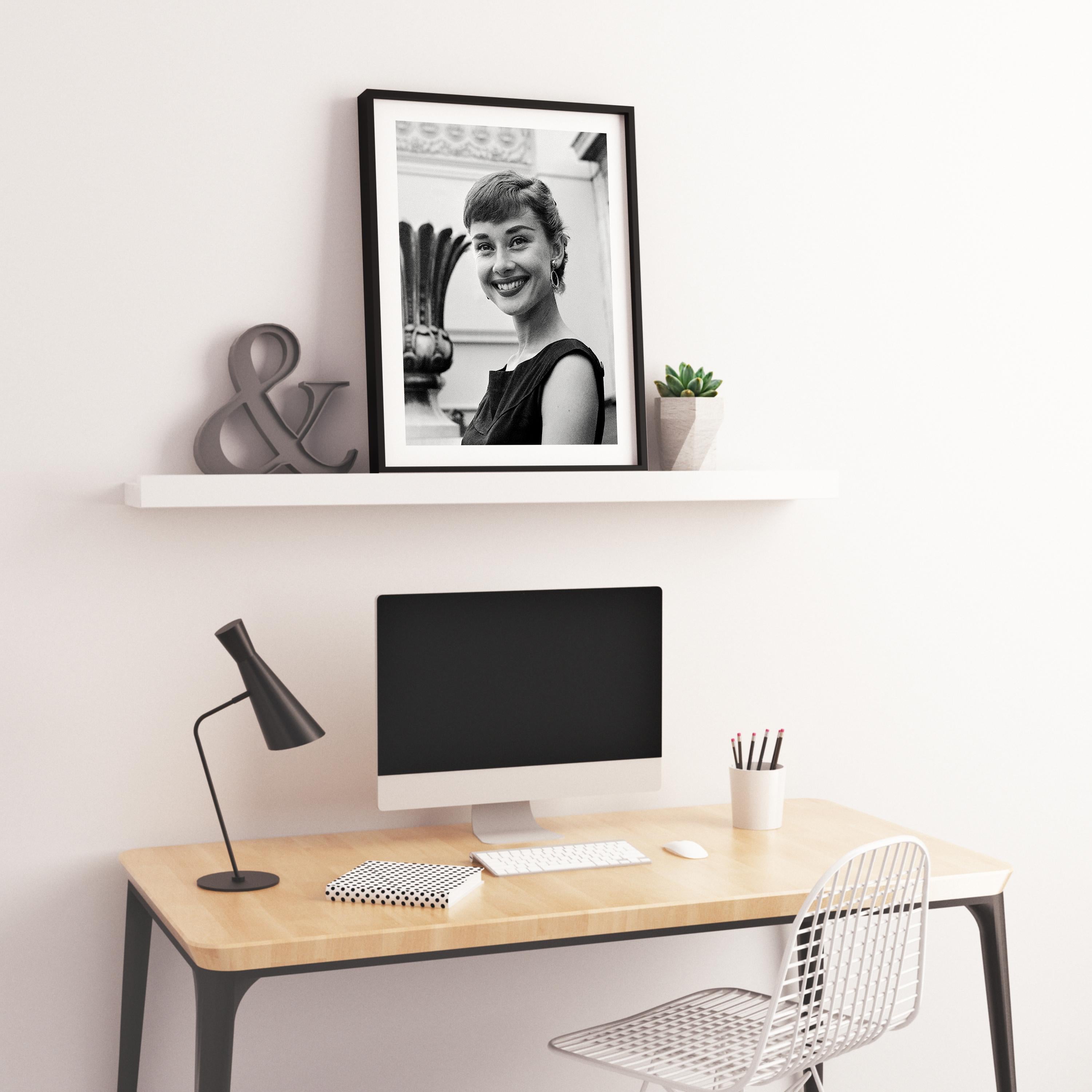 Audrey Hepburn Candid and Smiling Globe Photos Fine Art Print - Gray Black and White Photograph by Unknown