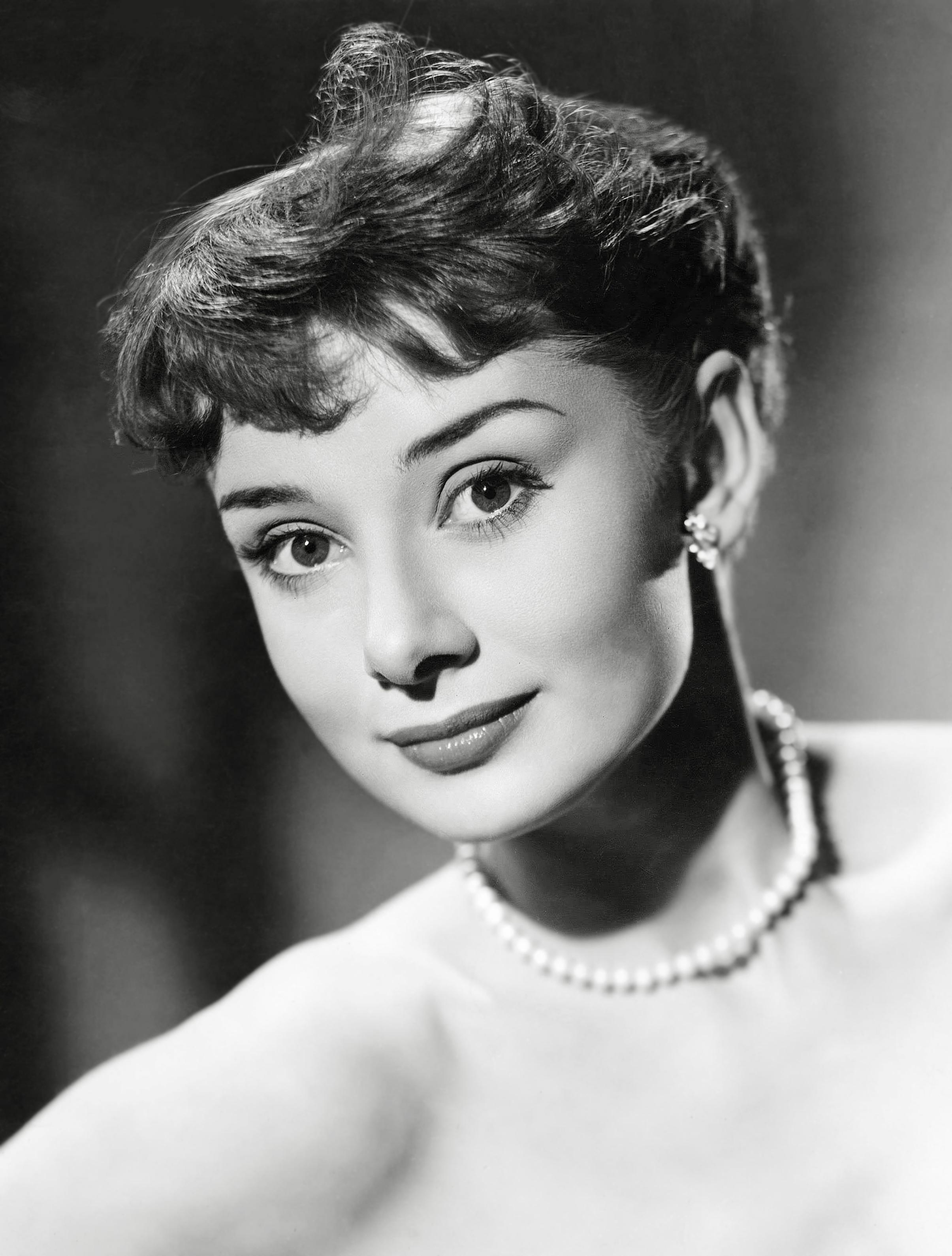 Unknown Portrait Photograph - Audrey Hepburn Smiling in Pearls Globe Photos Fine Art Print