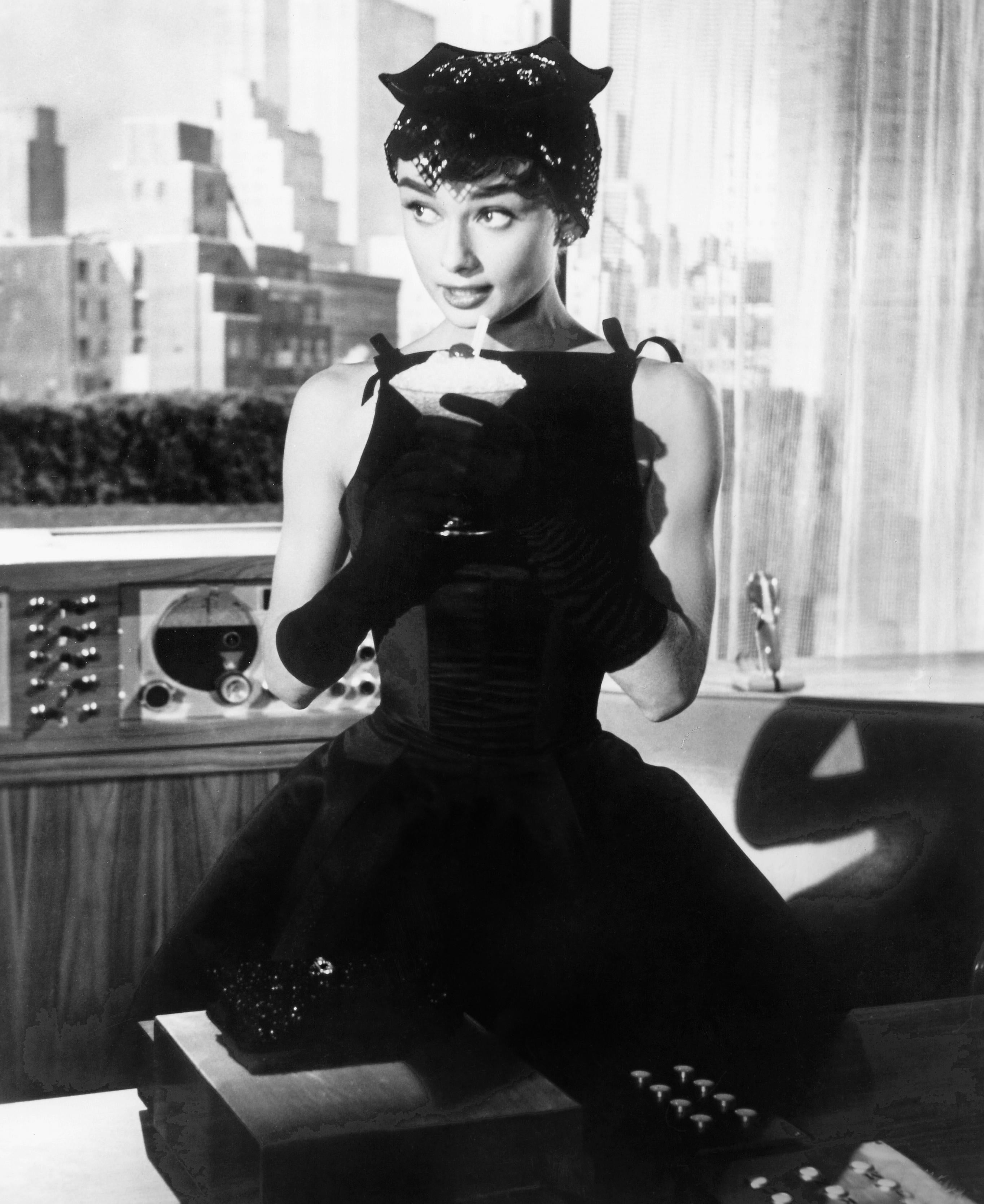 Unknown Black and White Photograph - Audrey Hepburn with Drink in "Sabrina" Globe Photos Fine Art Print
