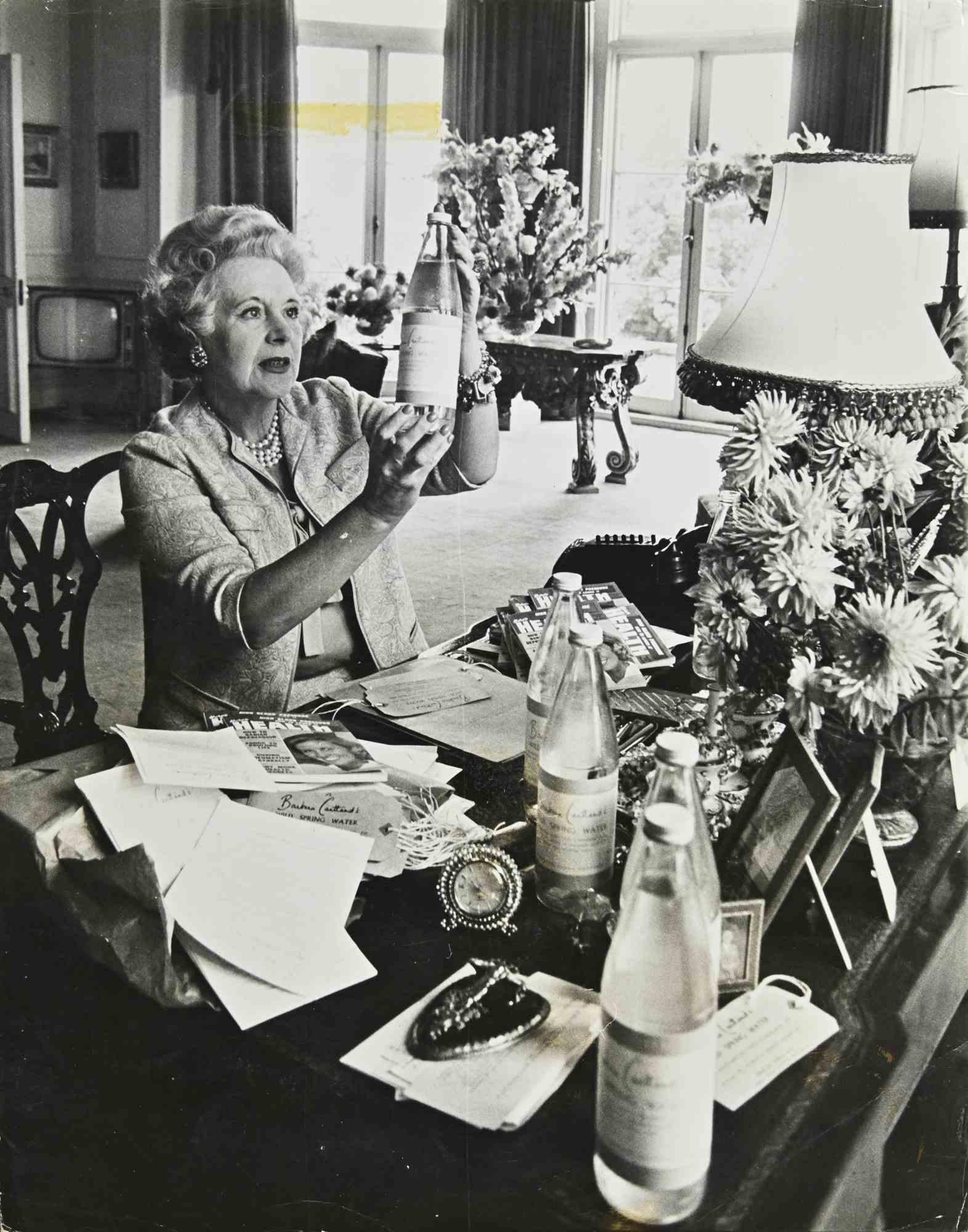 Unknown Figurative Photograph - Barbara Cartland Purveyor of Pure Flouride Free Water-Vintage Photograph - 1960s