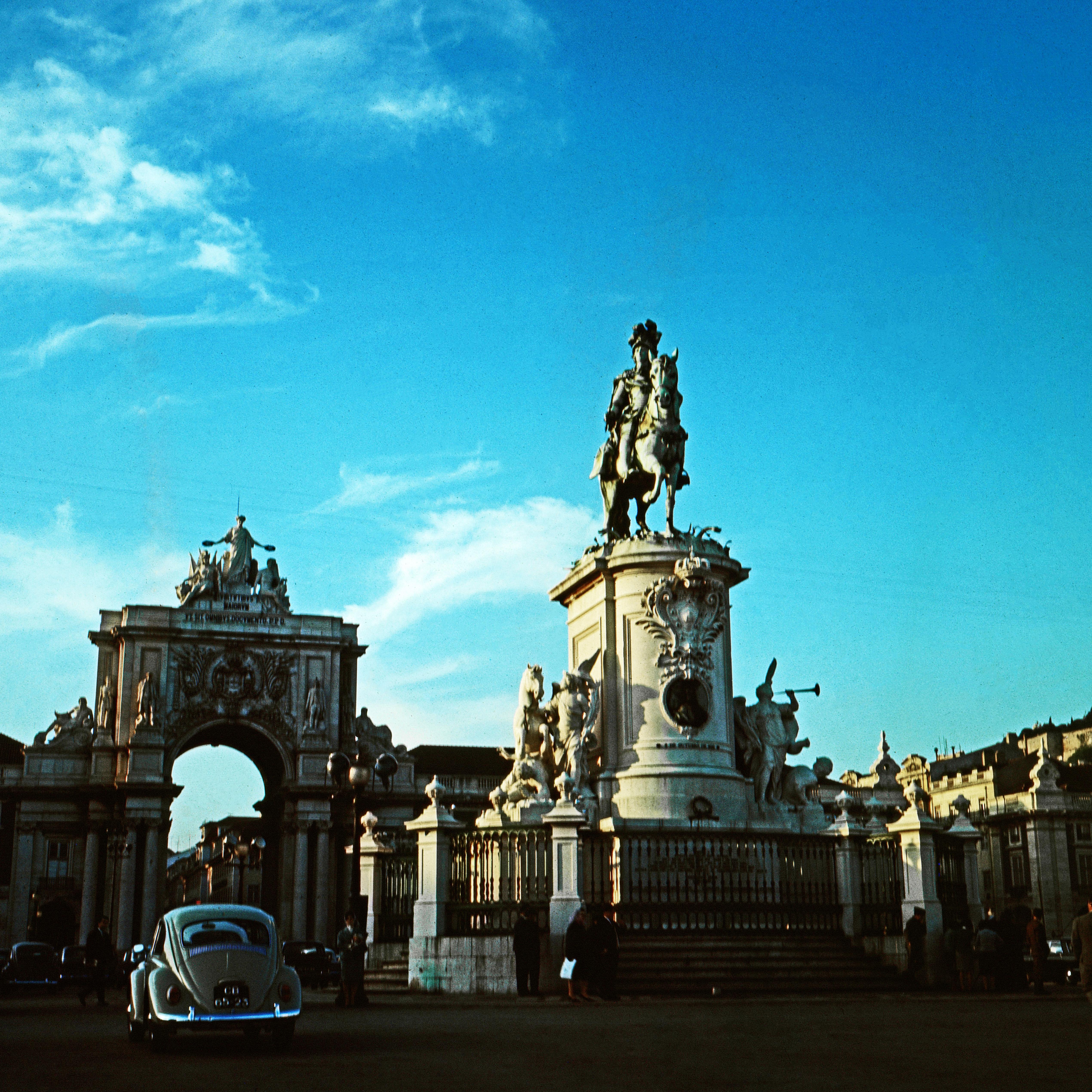 Unknown Landscape Photograph - Beetle Passing the Rua Augusta Arch, Lisbon, Portugal 1965
