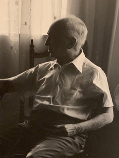 Mid-Century 1960's  Black and White Photograph of Man at Table