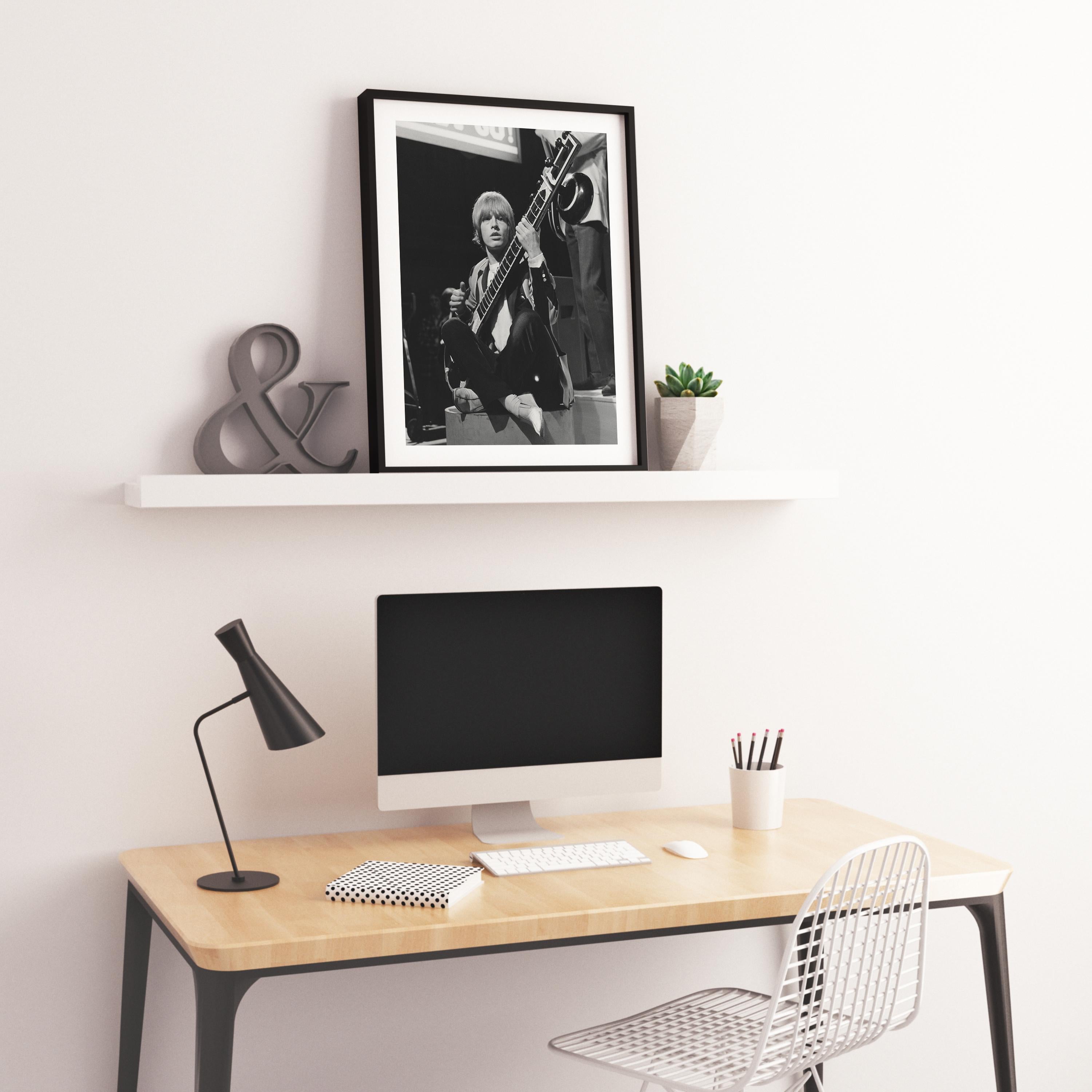 Brian Jones of The Rolling Stones Sitting with Guitar Fine Art Print - Black Portrait Photograph by Unknown