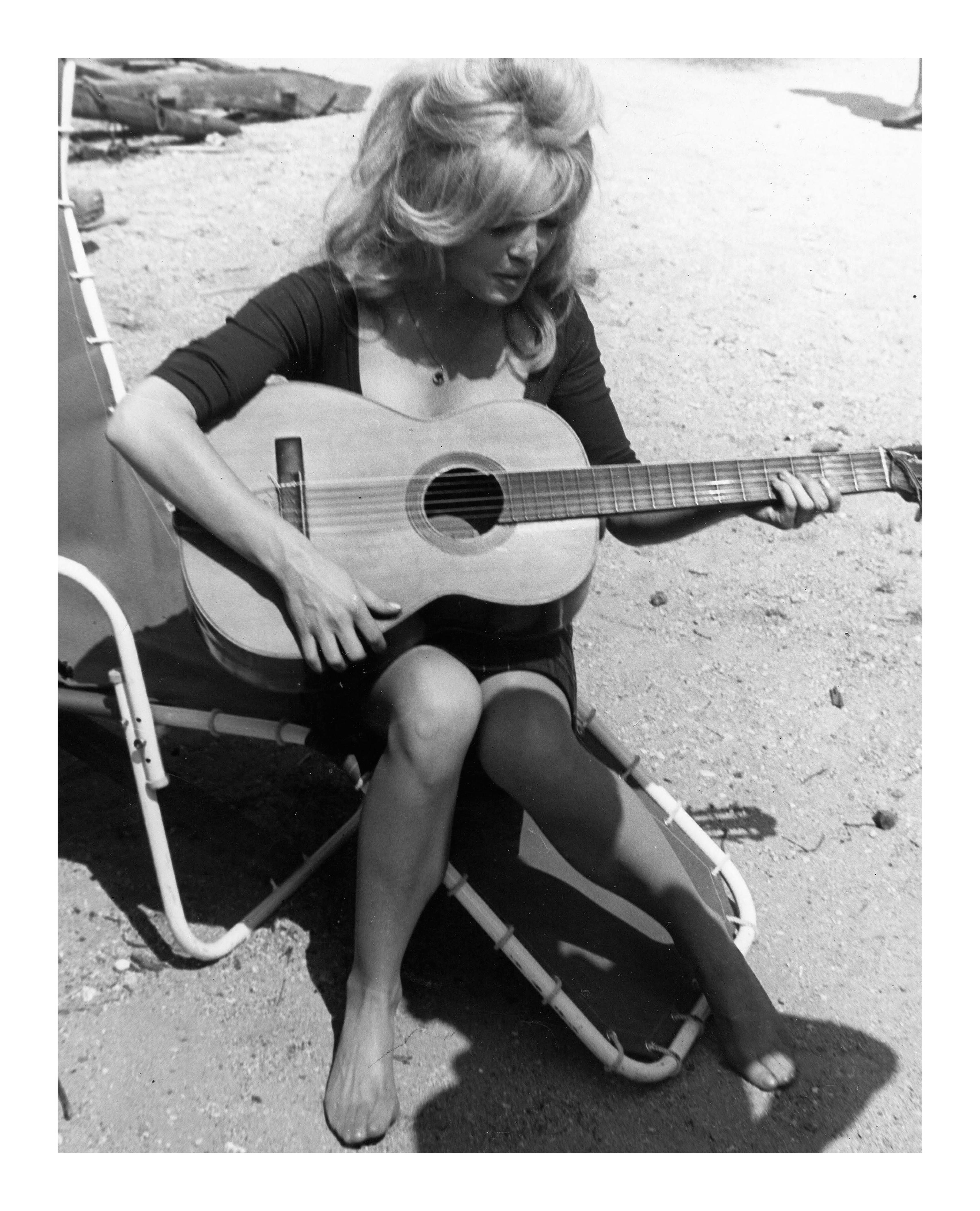 Brigitte Bardot: Beach Guitar - Contemporary Photograph by Unknown