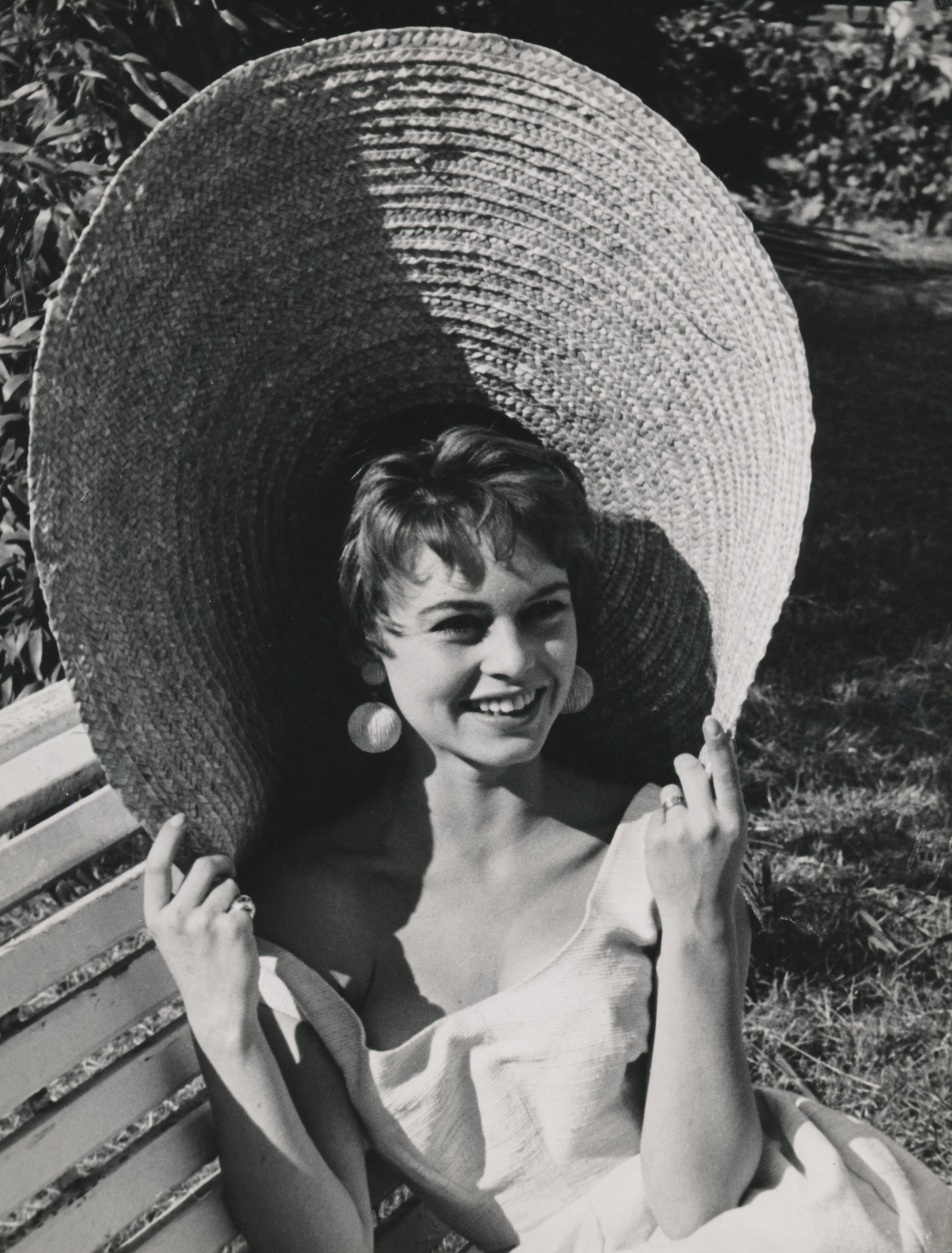 Unknown Black and White Photograph - Brigitte Bardot in Oversized Hat Fine Art Print