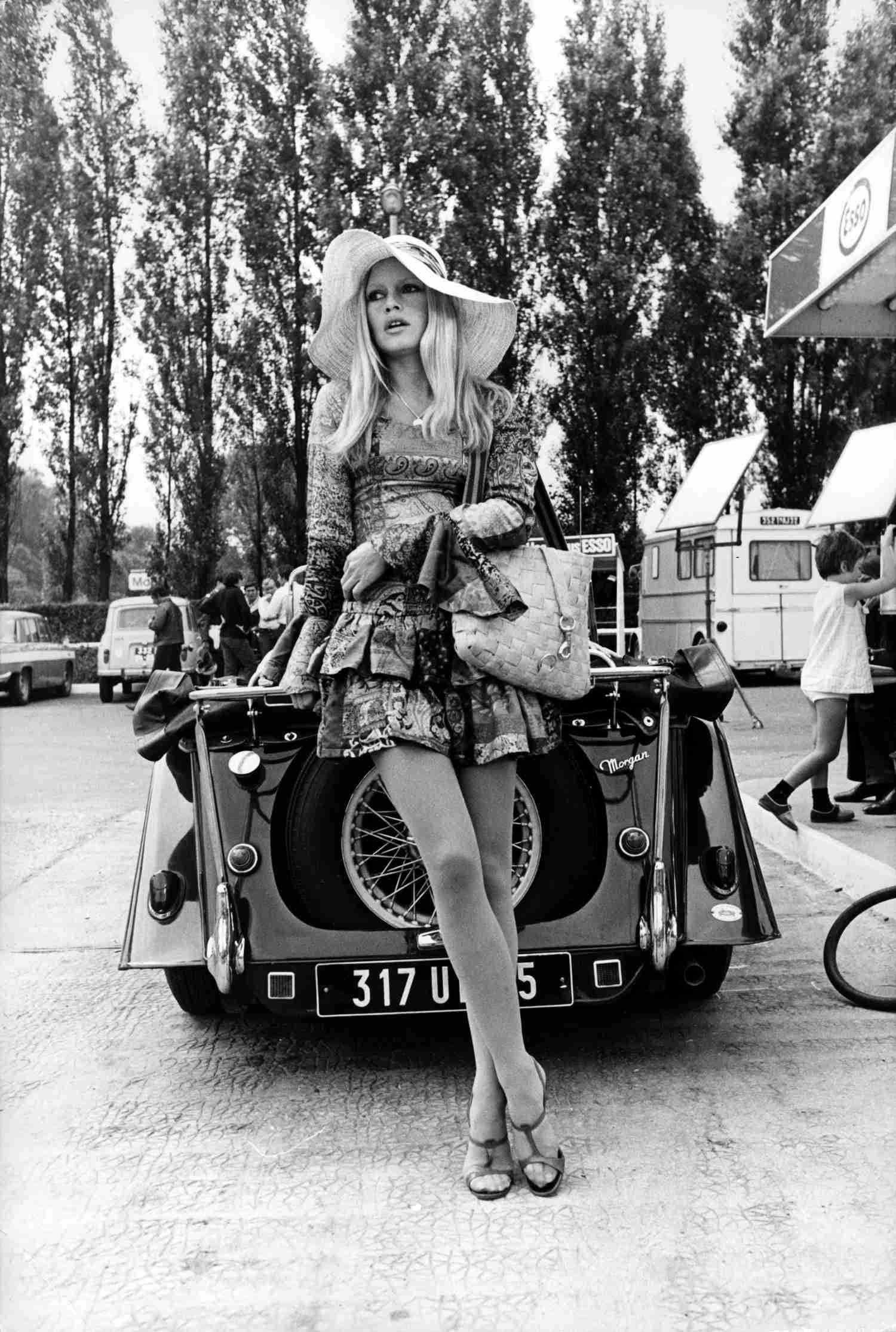 Unknown Black and White Photograph - Brigitte Bardot Leaning on Classic Car Fine Art Print
