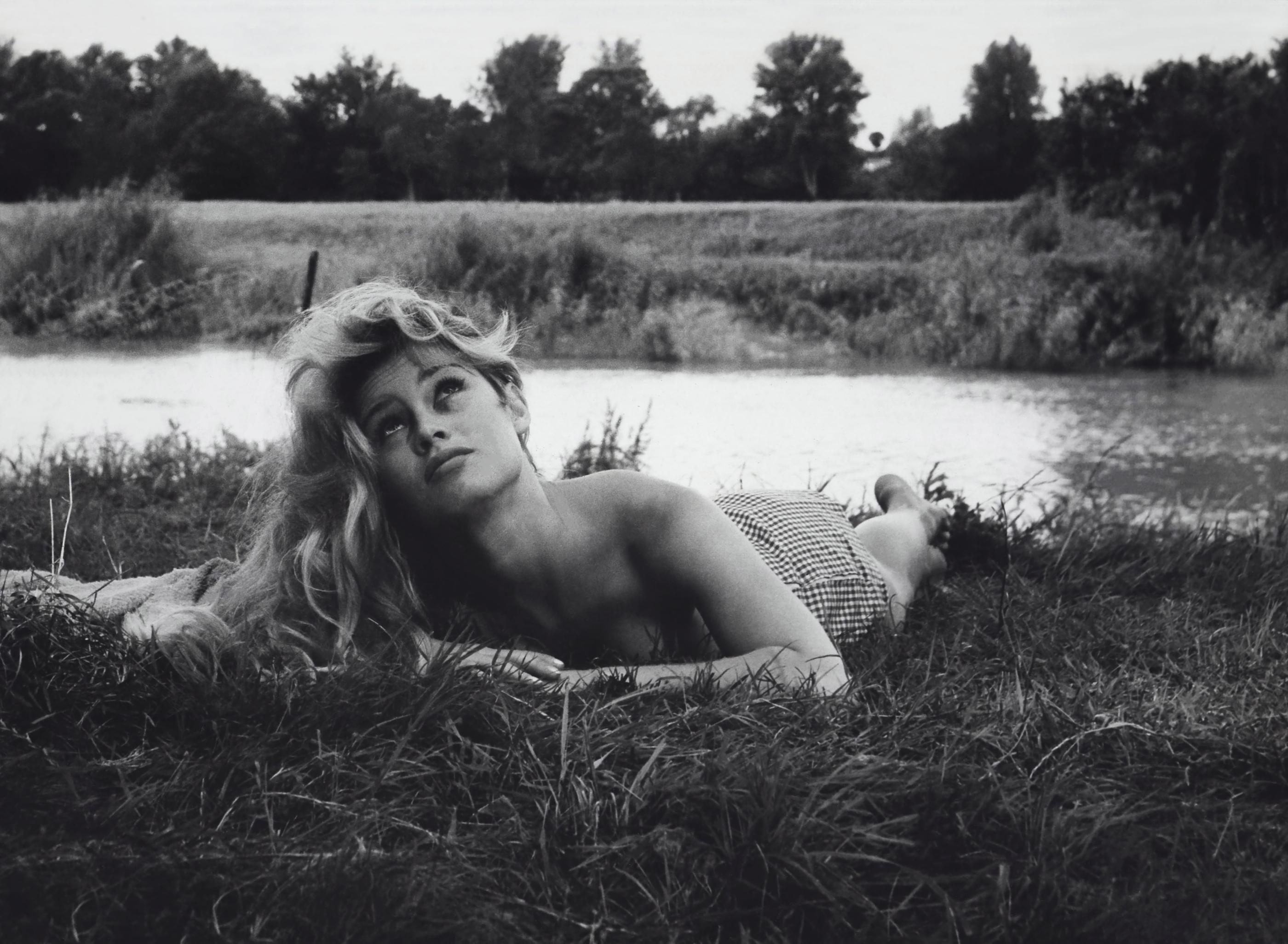 Unknown Portrait Photograph - Brigitte Bardot Lying in Grass
