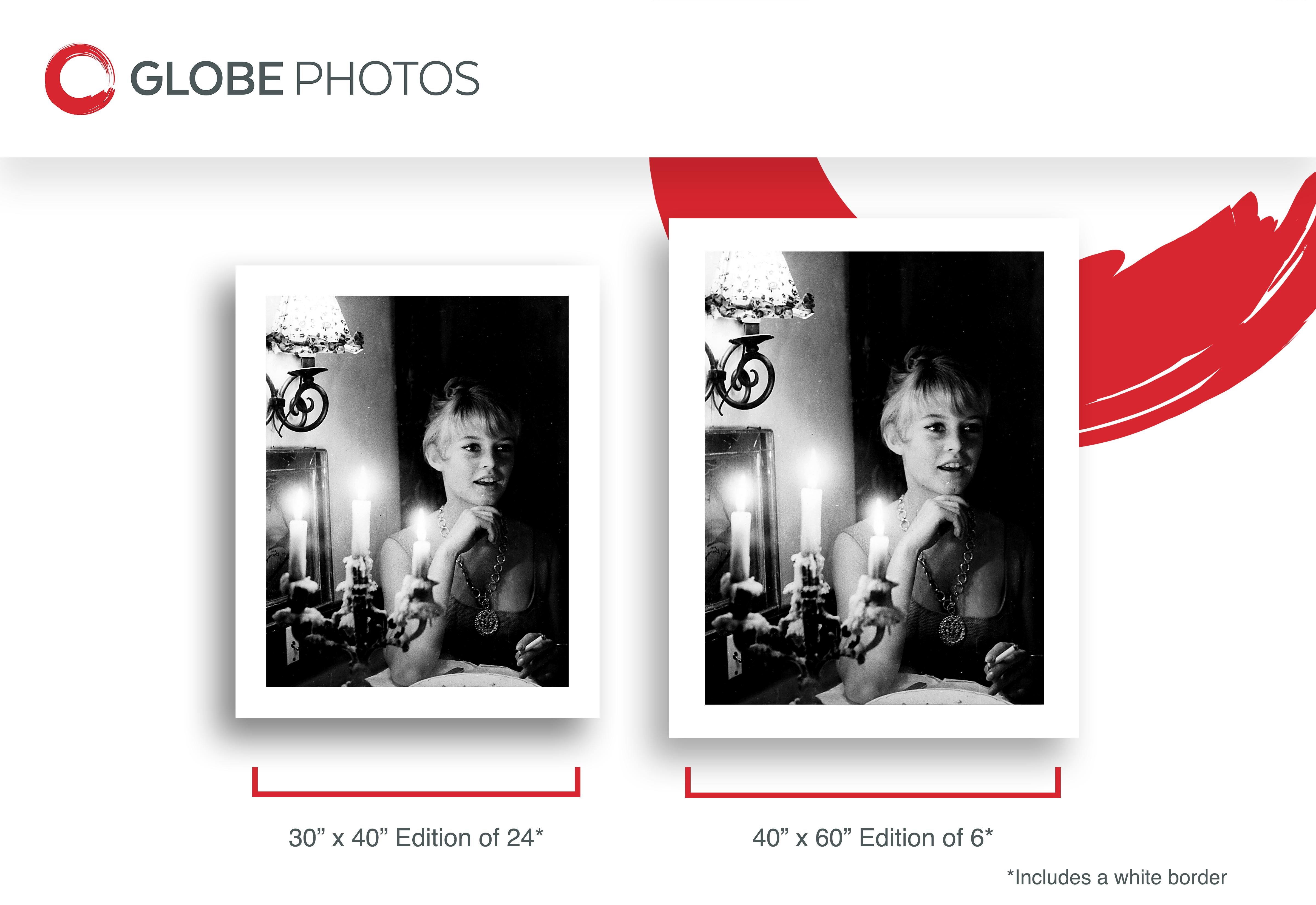 Candid image of Hollywood star Brigitte Bardot smoking while sitting next to a candelabra in the dark.

This listing is for a limited edition archival print.

What's included:
- Limited Edition Archival Print
- Numbered Certificate of