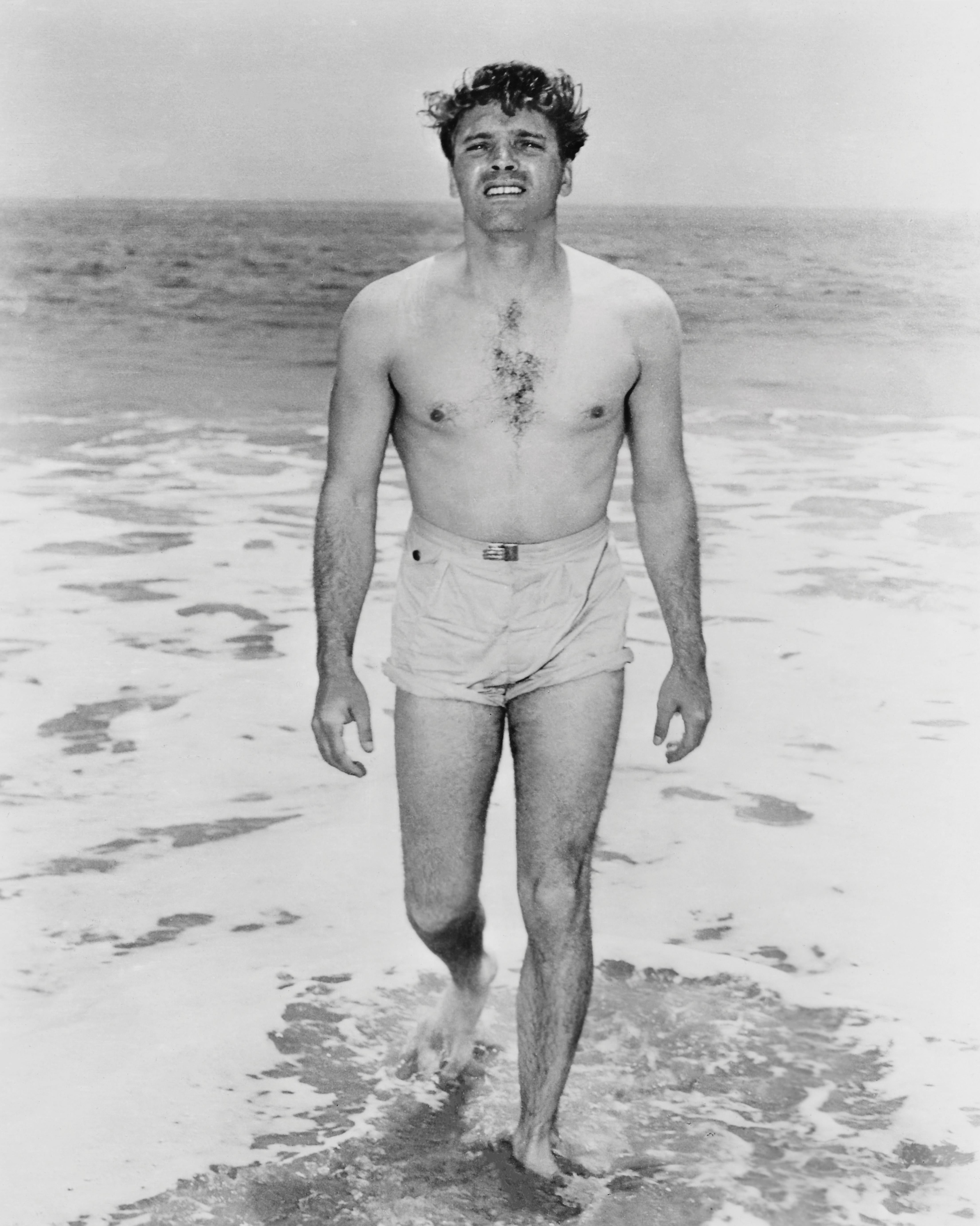 Unknown Portrait Photograph - Burt Lancaster Smiling Shirtless on the Shore Fine Art Print