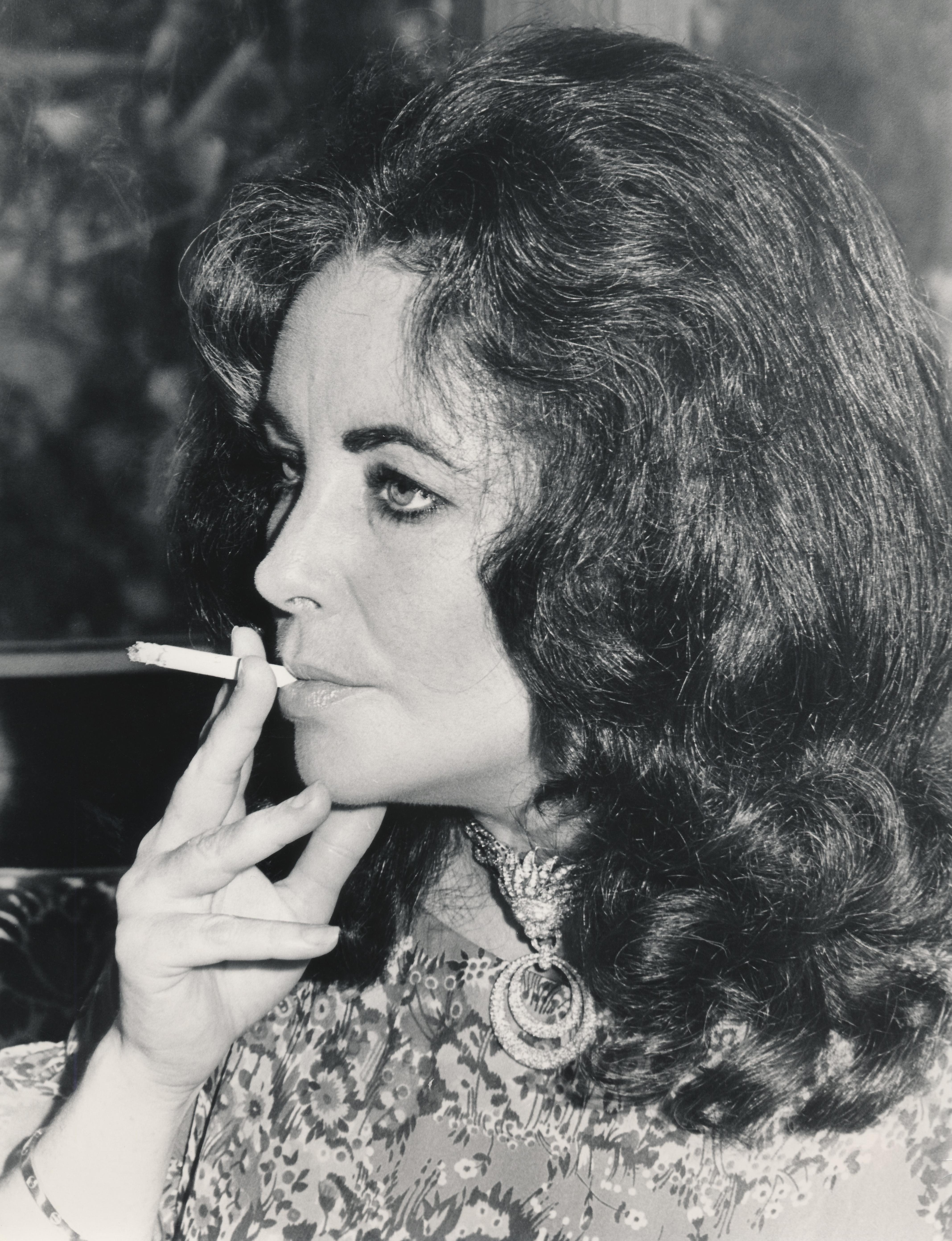 Unknown Black and White Photograph - Candid Elizabeth Taylor Smoking Fine Art Print