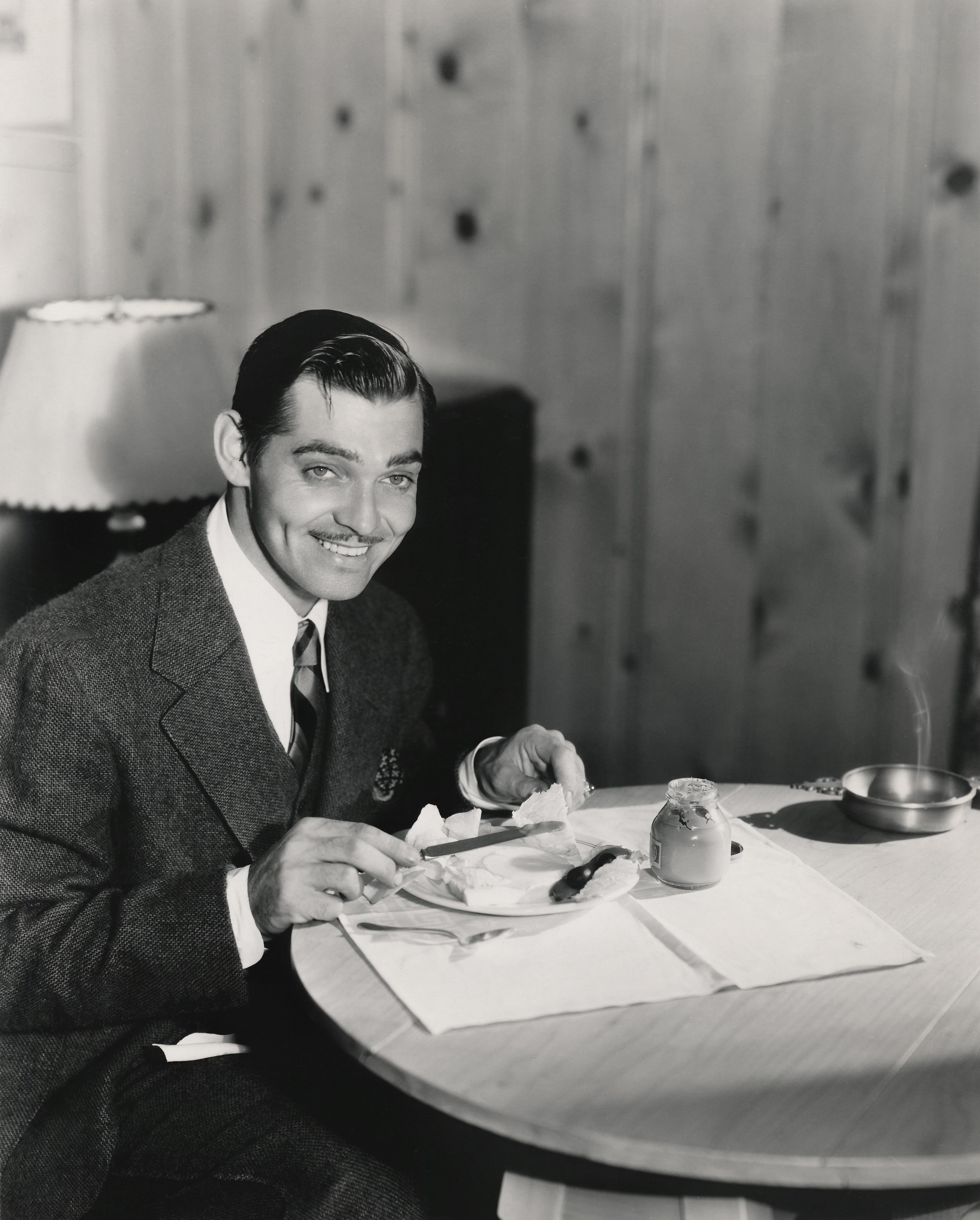 Unknown Black and White Photograph - Clark Gable Having Breakfast Fine Art Print