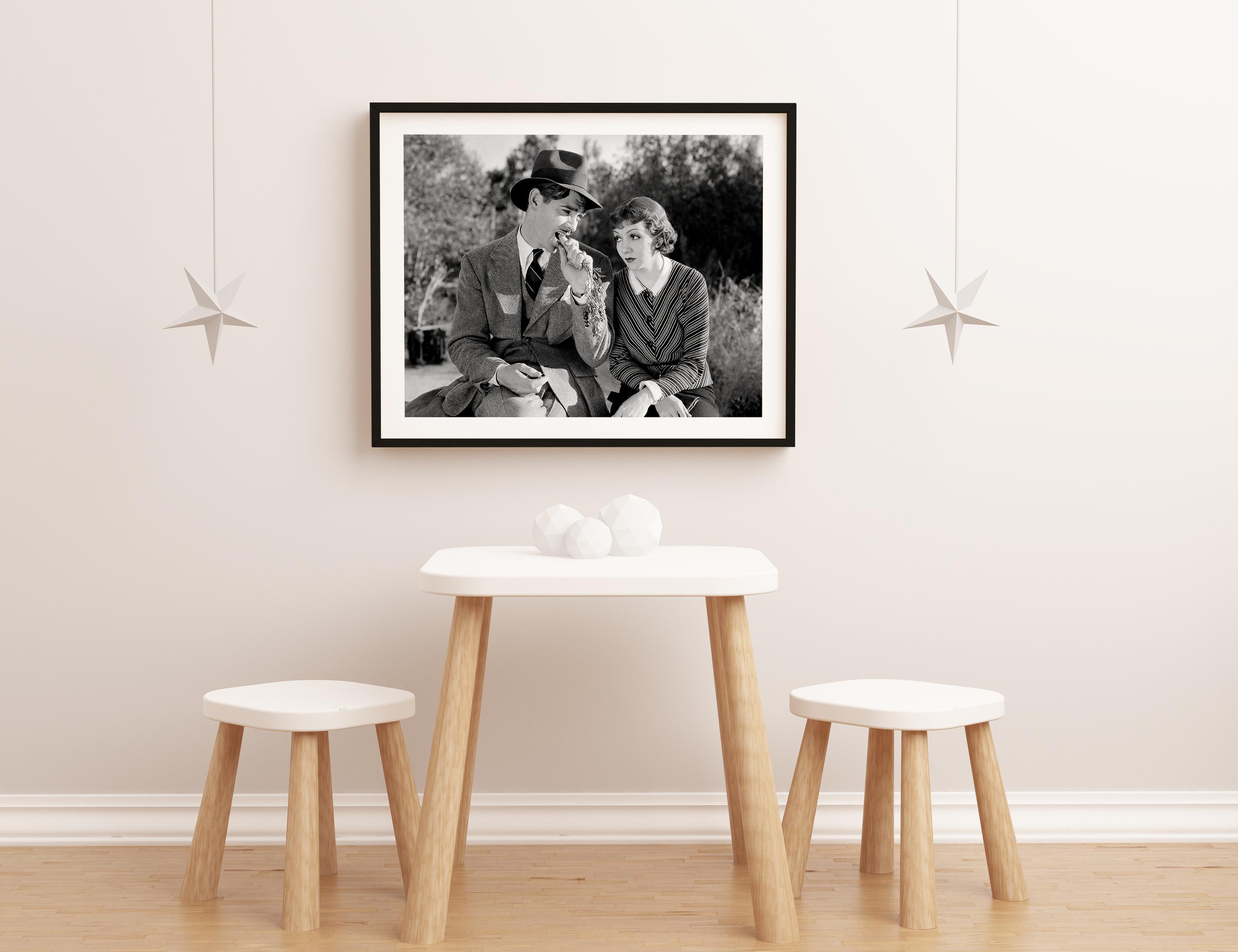 Claudette Colbert and Clark Gable Sitting on Bench Globe Photos Fine Art Print For Sale 1
