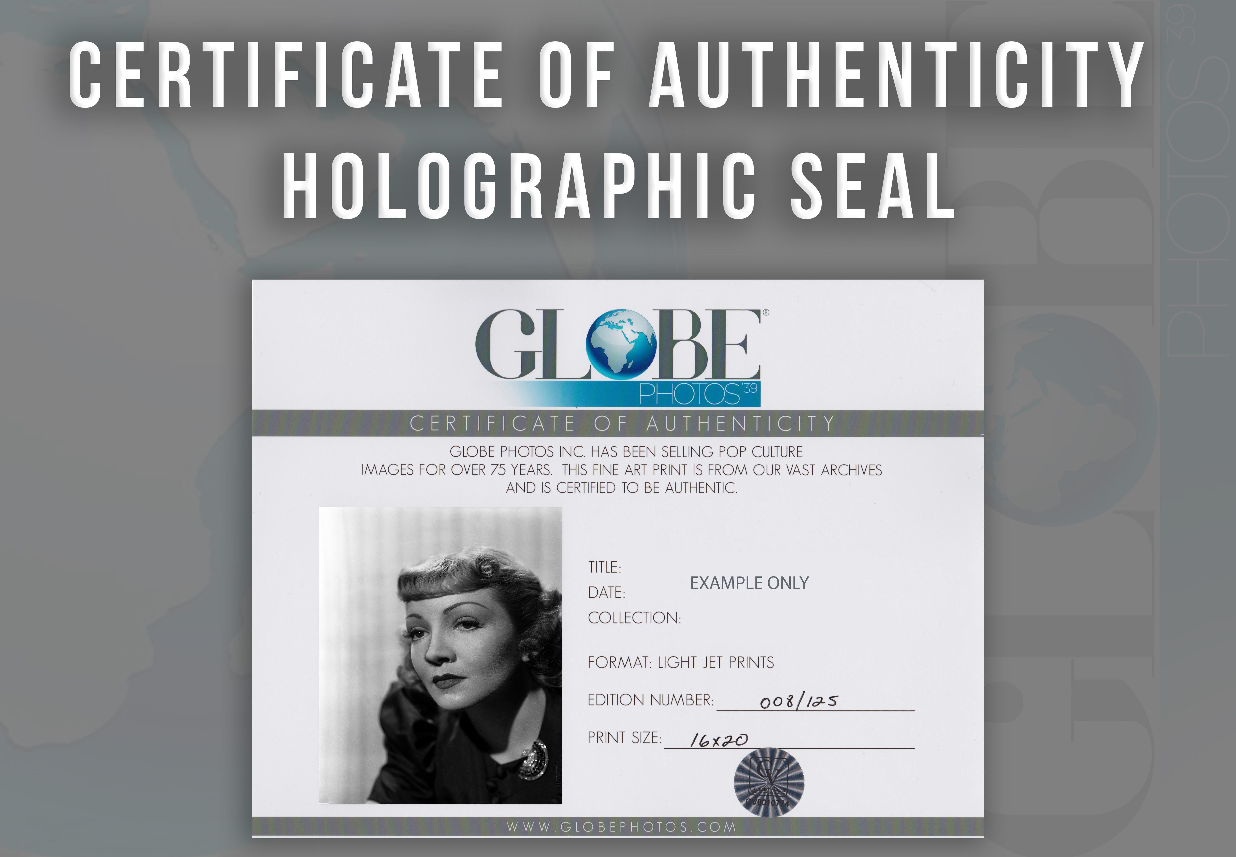 This black and white portrait features American film actress and a leading lady in Hollywood for over two decades, Claudette Colbert. Colbert is featured here looking away for a closeup classical studio portrait.

This image is credited to Globe