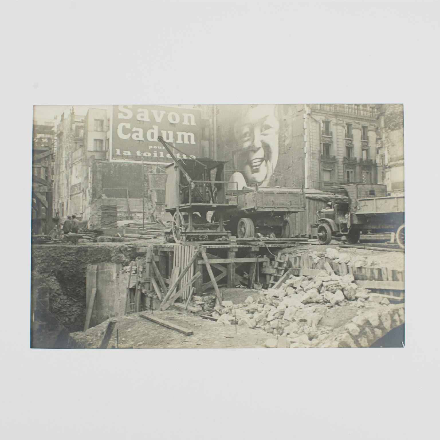 A unique original silver gelatin black and white photography. A construction site on The Boulevard Haussmann in Paris, France, June 19, 1926. 
A view of the Boulevard Haussmann in Paris with a deep excavation construction site. In the background is