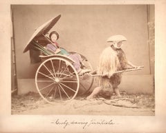Antique Cooly, drawing Jinrikisha (Rickshaw)