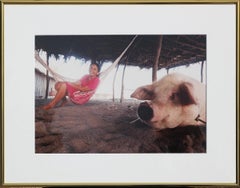 Vintage Daily Life Beach Color Photograph of a Smiling Woman in a Hammock with a Pig 