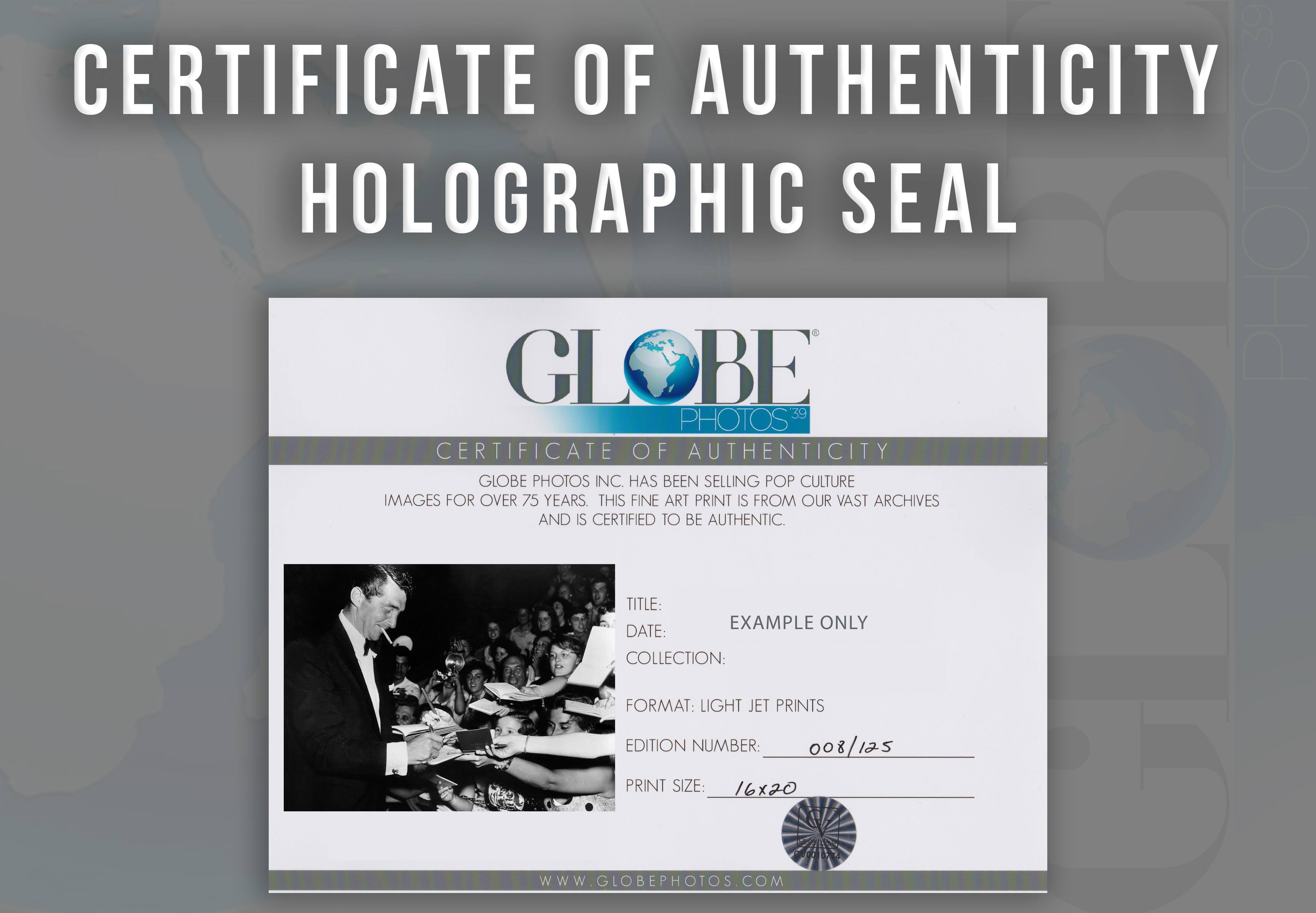 Dean Martin Signing Autographs Globe Photos Fine Art Print - Black Portrait Photograph by Unknown