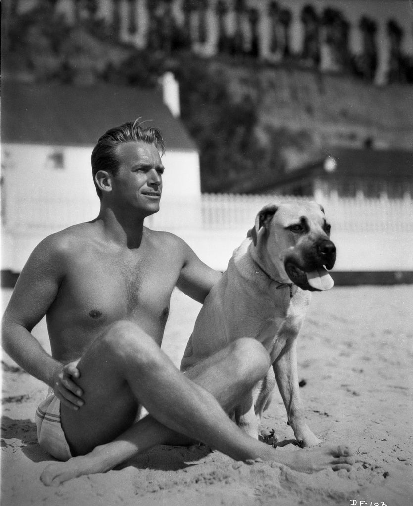 Unknown Black and White Photograph - Douglas Fairbanks Jr. with Dog on Beach Fine Art Print