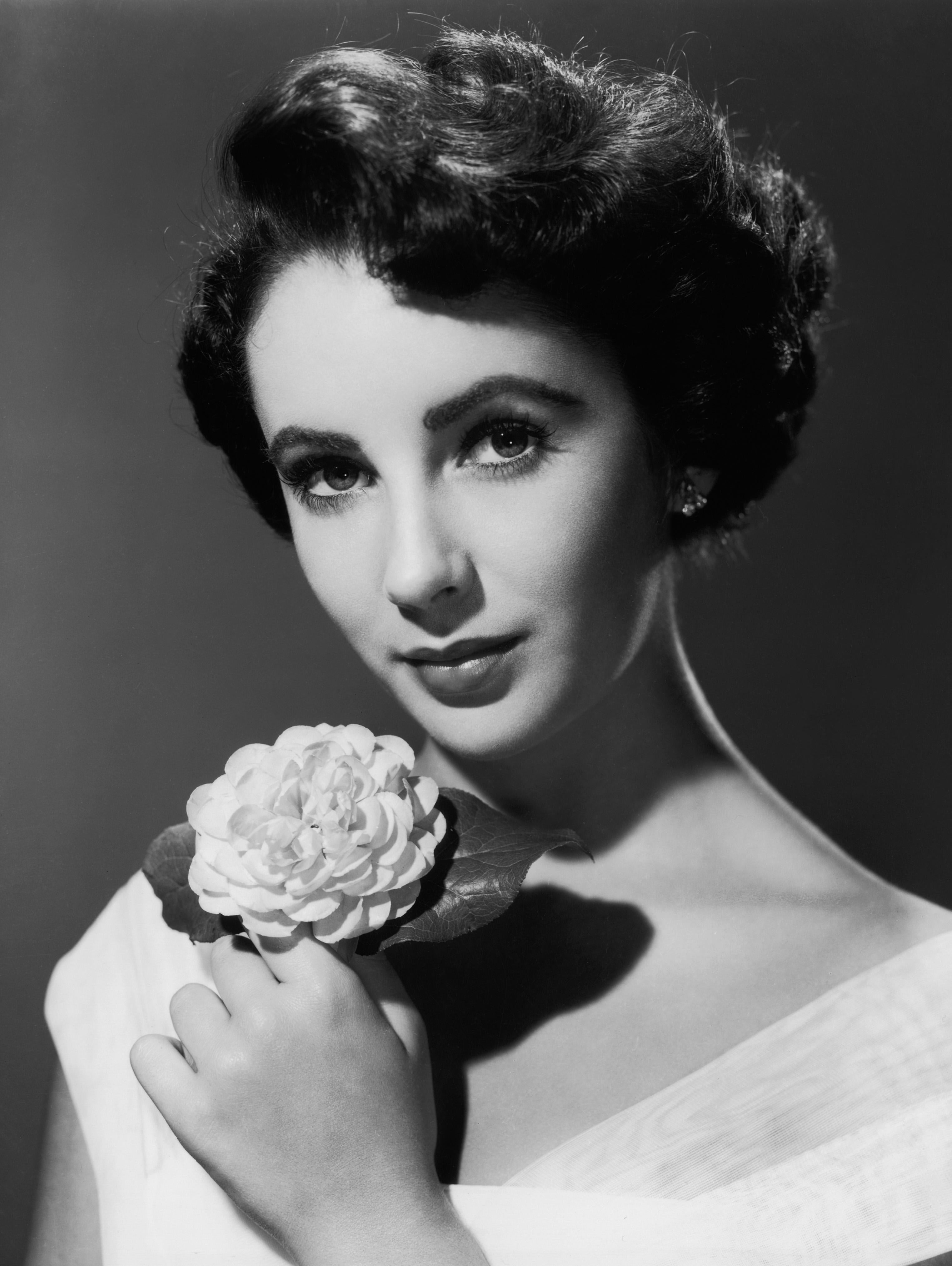 Unknown Black and White Photograph - Elizabeth Taylor Posed with Flower Globe Photos Fine Art Print