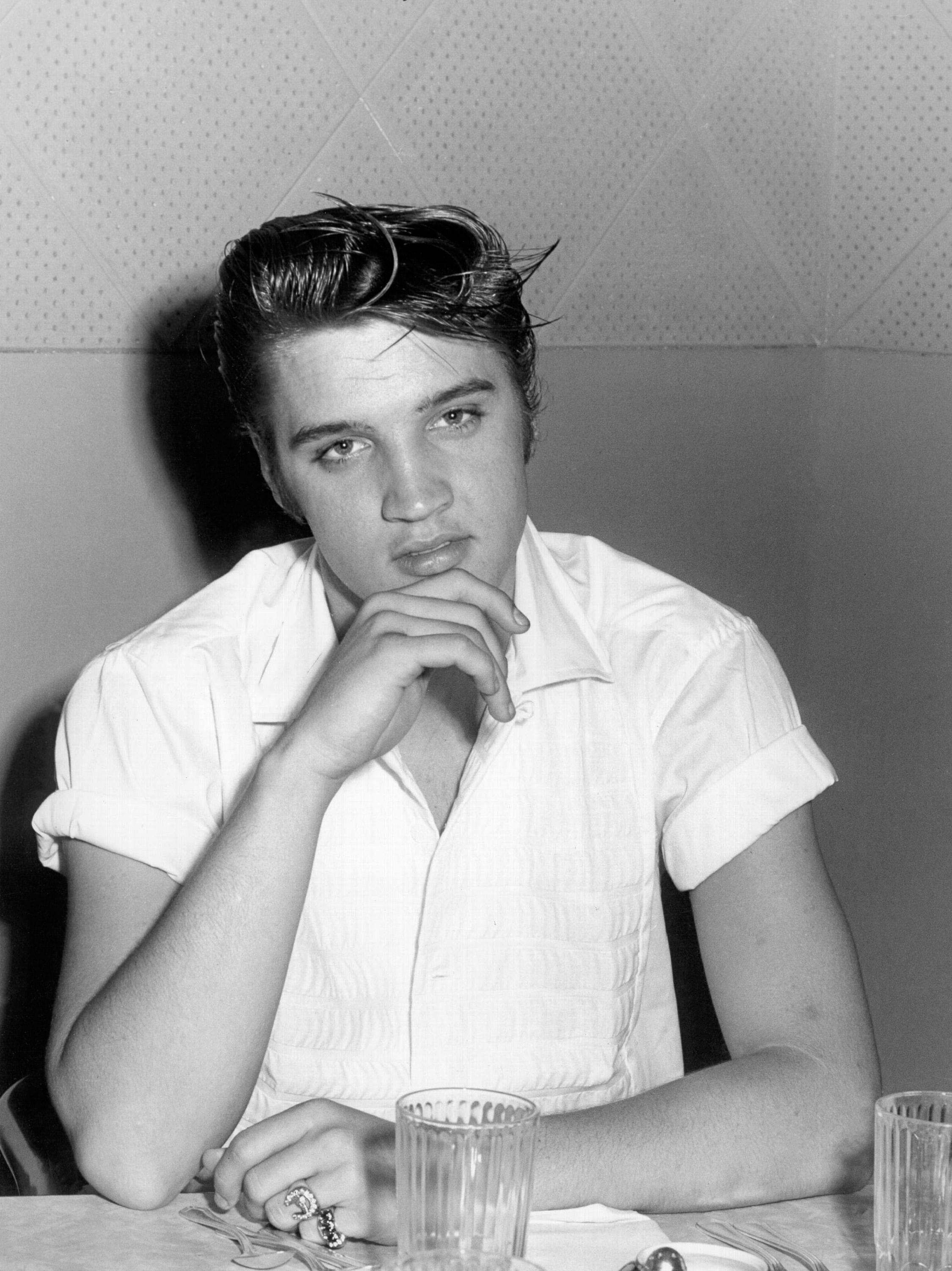 Unknown Portrait Photograph - Elvis Presley Candid at the Table Globe Photos Fine Art Print