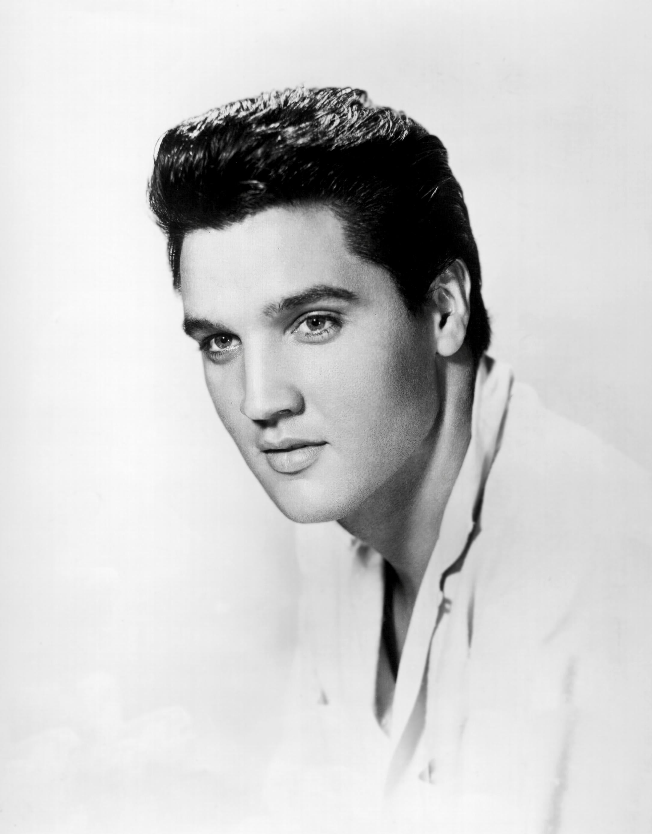 Unknown Black and White Photograph - Elvis Presley: Handsome Star on White Globe Photos Fine Art Print