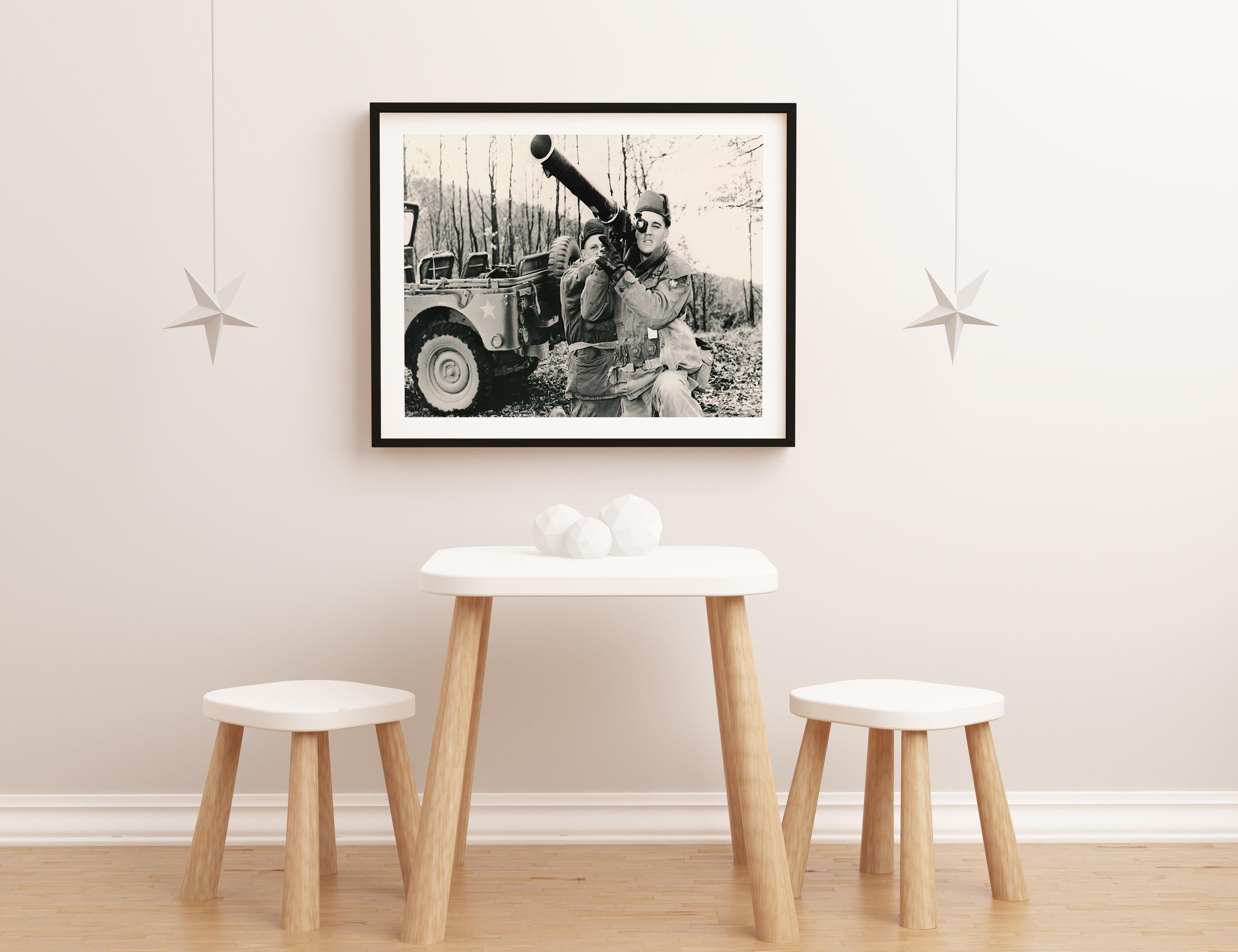 Elvis Presley Holding a Bazooka Fine Art Print - Gray Black and White Photograph by Unknown
