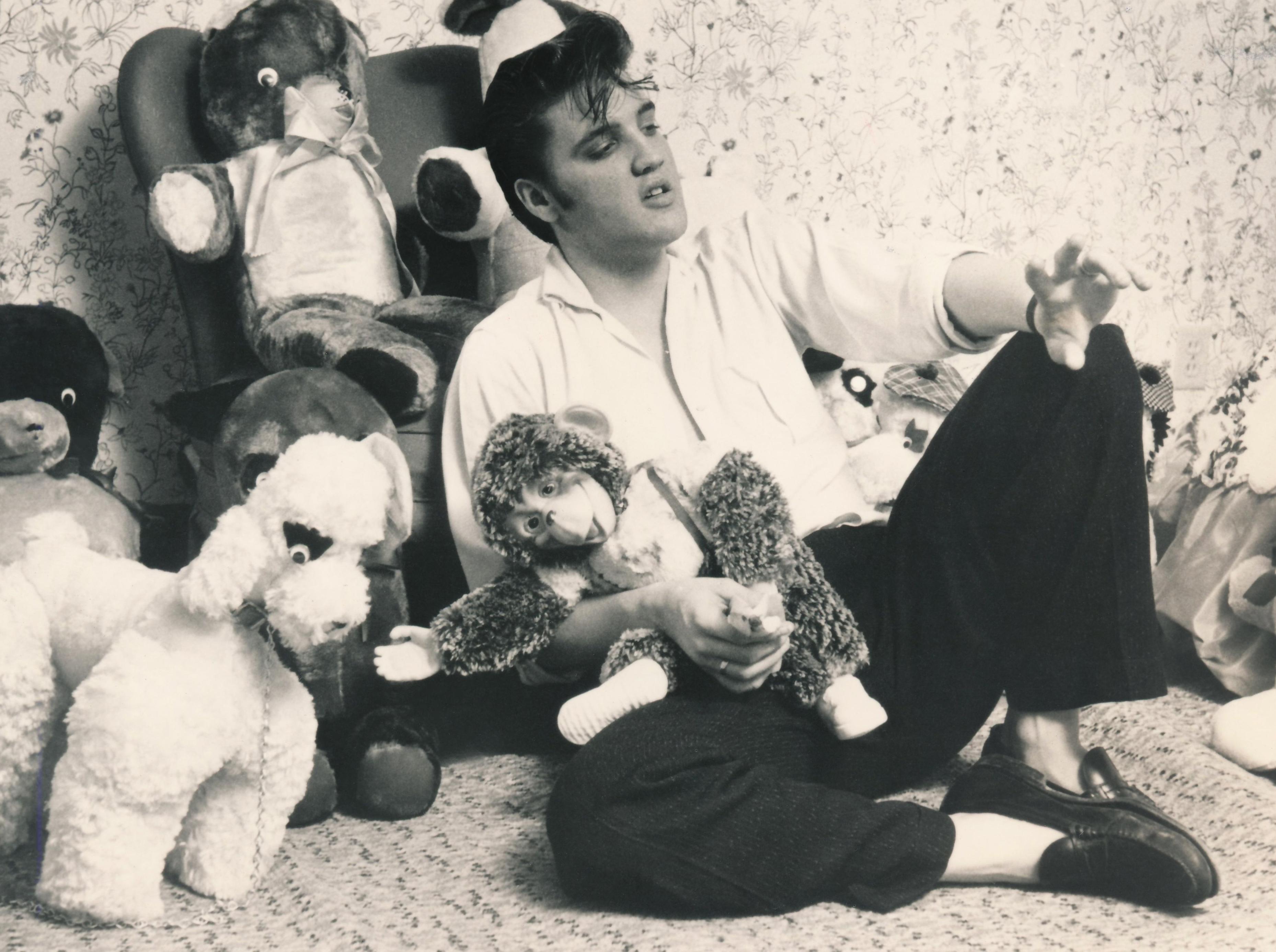 Unknown Black and White Photograph - Elvis with Stuffed Animals Fine Art Print