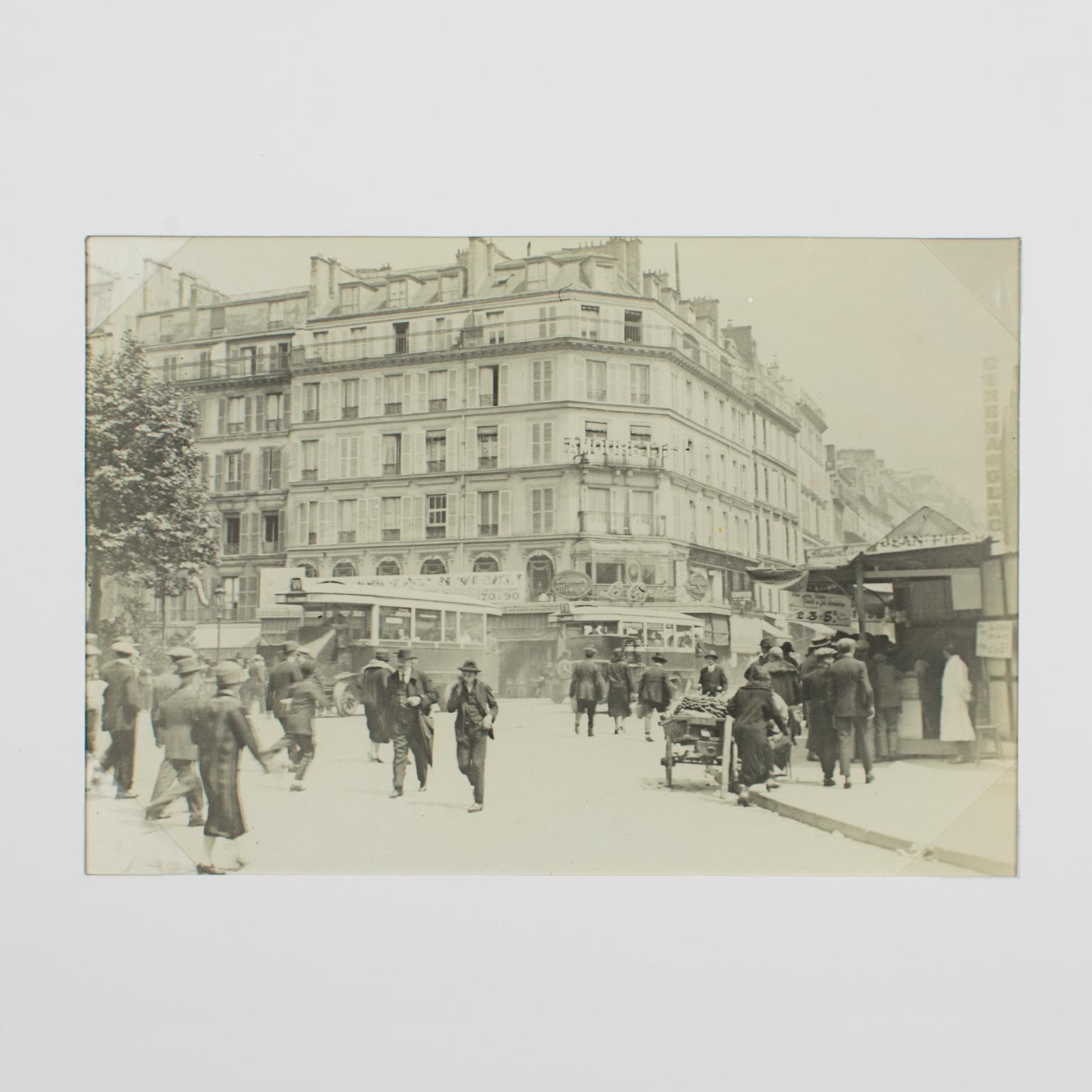 Faubourg du Temple in Paris, 1926, Silver Gelatin Black and White Photography - Beige Landscape Photograph by Unknown