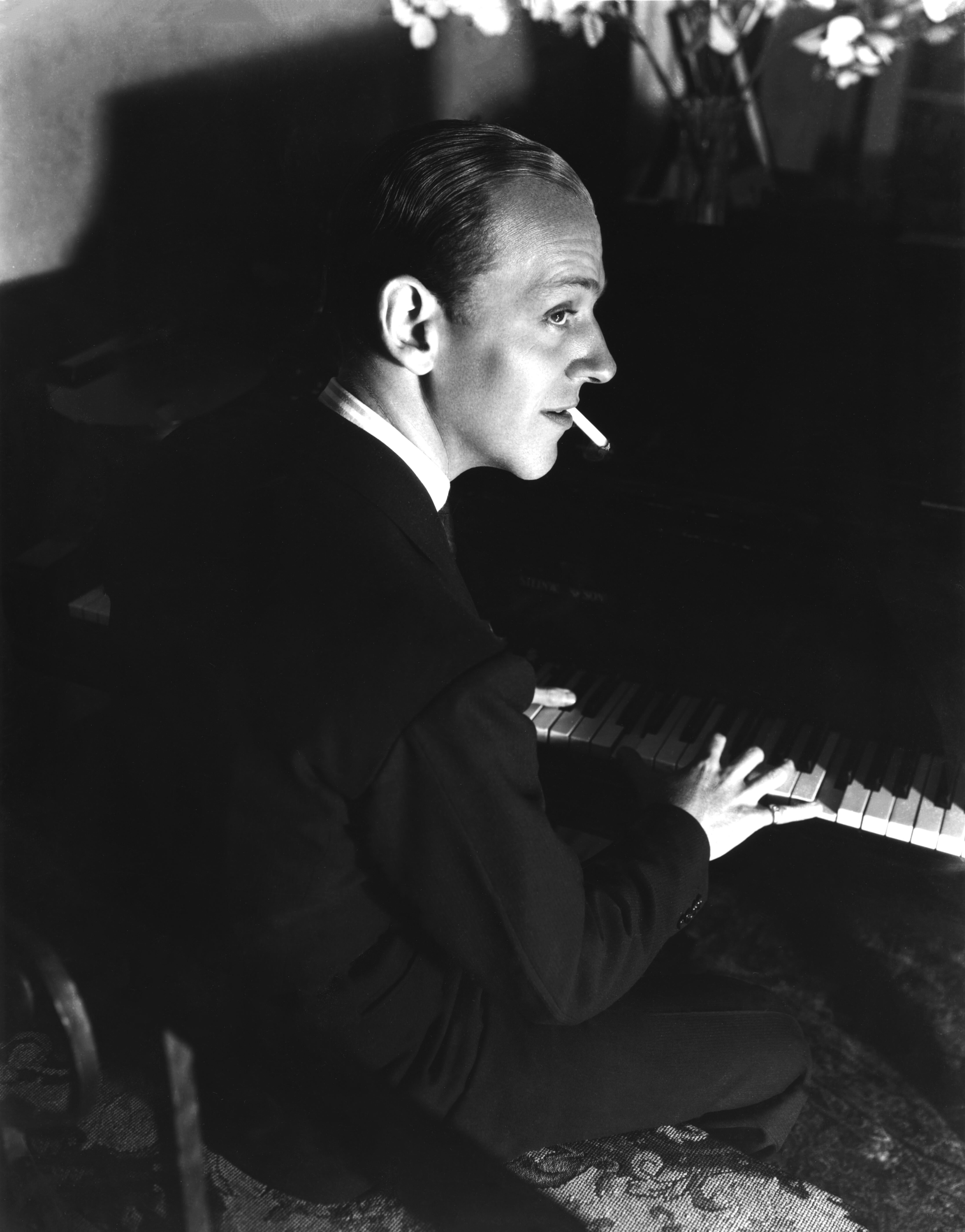 Unknown Portrait Photograph - Fred Astaire Playing Piano and Smoking Movie Star News Fine Art Print