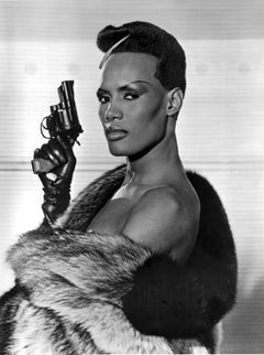 Grace Jones Holding Pistol