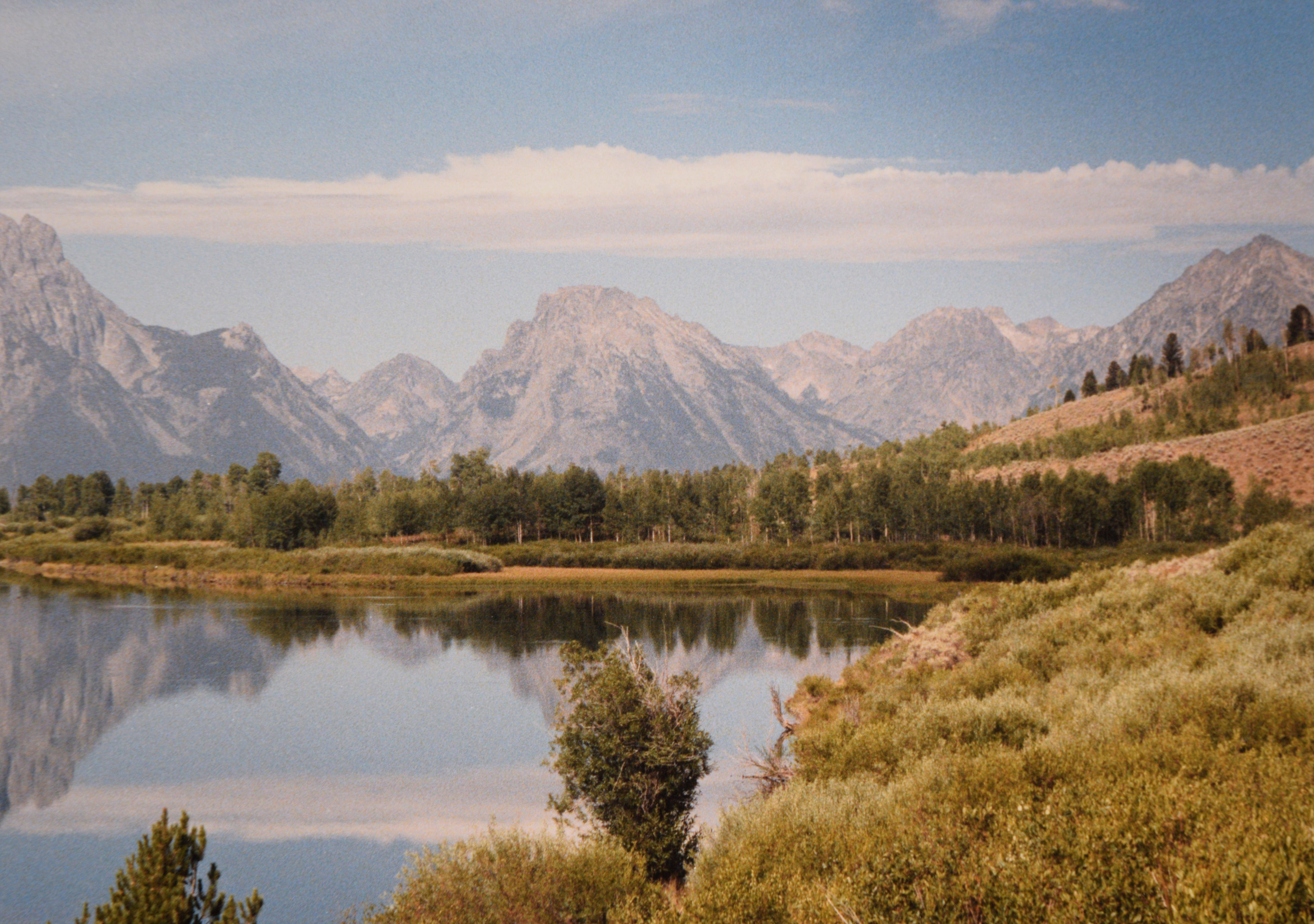 Grand Teton National Park - Original 1988 Photograph

Original 1988 color photograph of the Grand Teton National Park in Wyoming in the Style of Steve Mattheis,
. The photograph shows the Teton mountain range, with its clear reflection on the calm