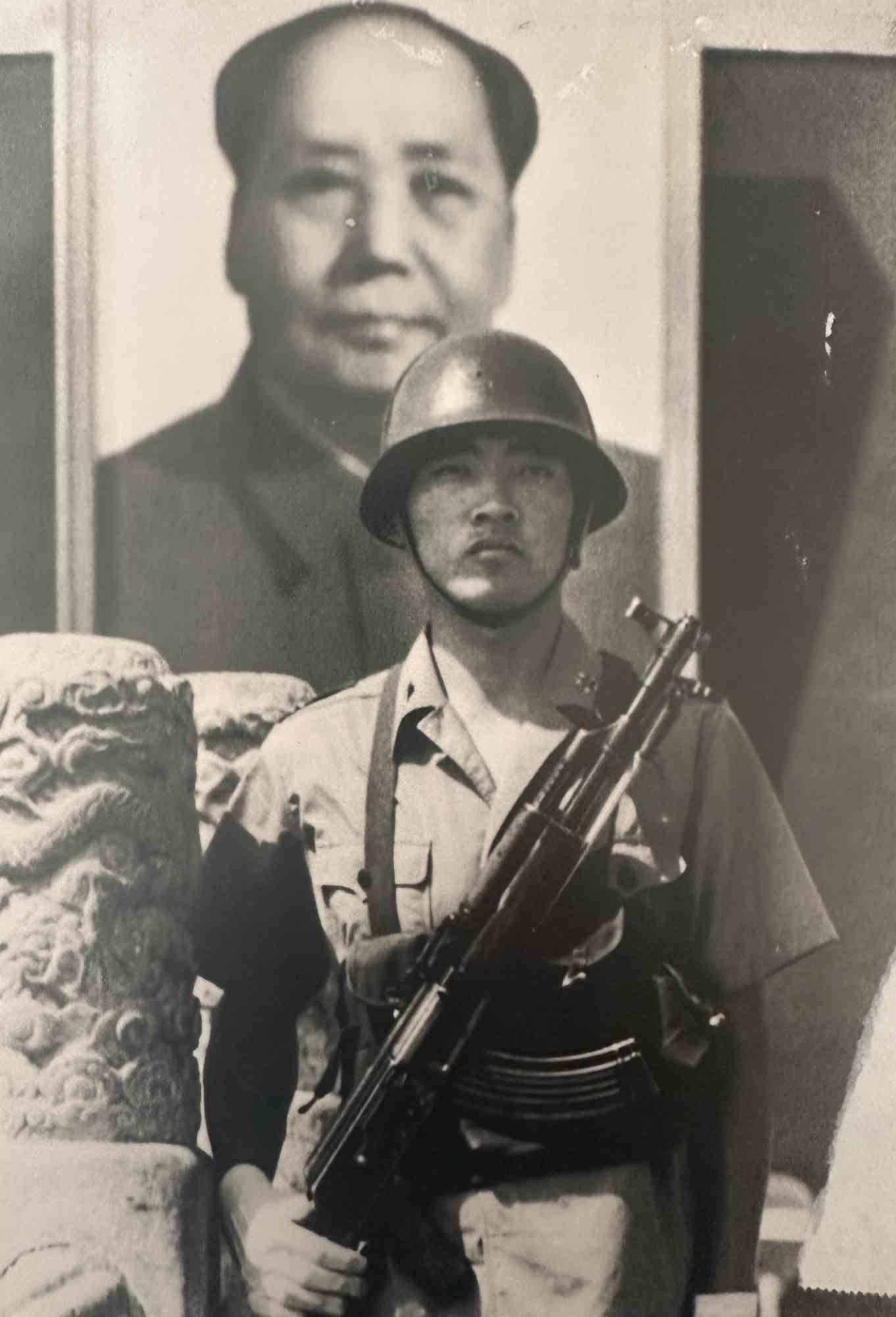 Unknown Figurative Photograph - Historical Photo - Chinese Soldier in front of a Portrait of Mao - 1970s