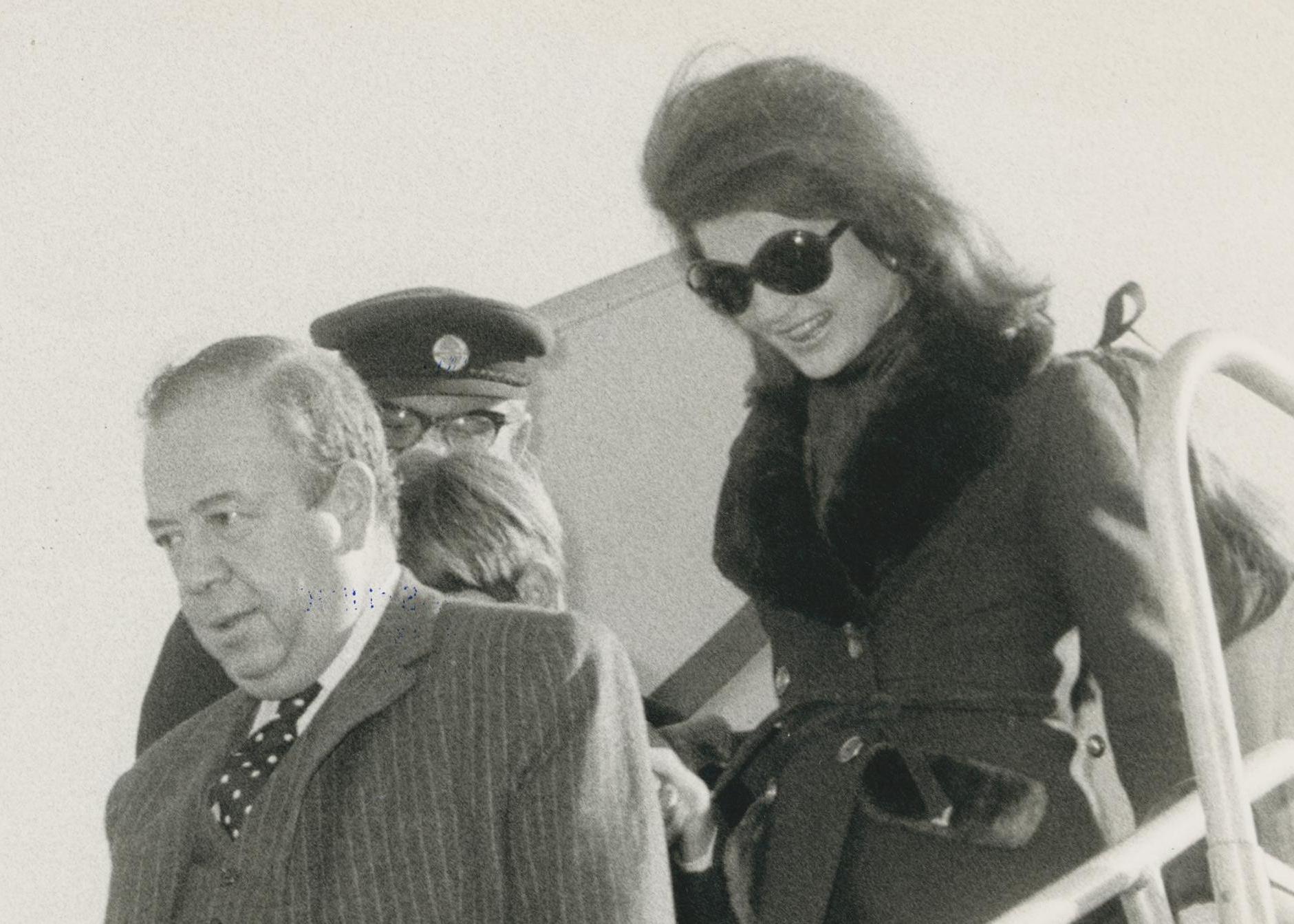 Jackie Kennedy leaving the plane, 1970s - Photograph by Unknown