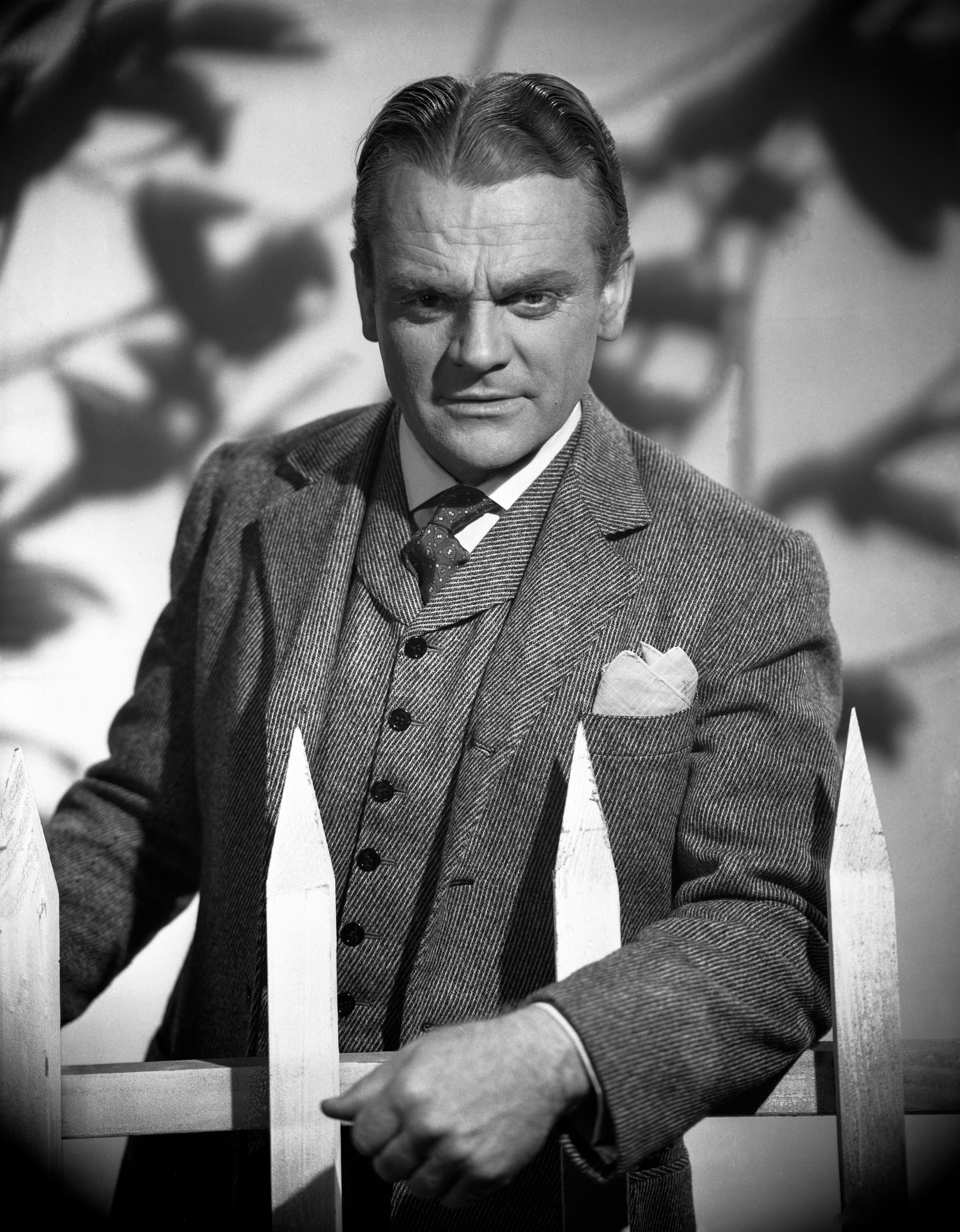 Unknown Portrait Photograph - James Cagney Leaning on Fence Movie Star News Fine Art Print