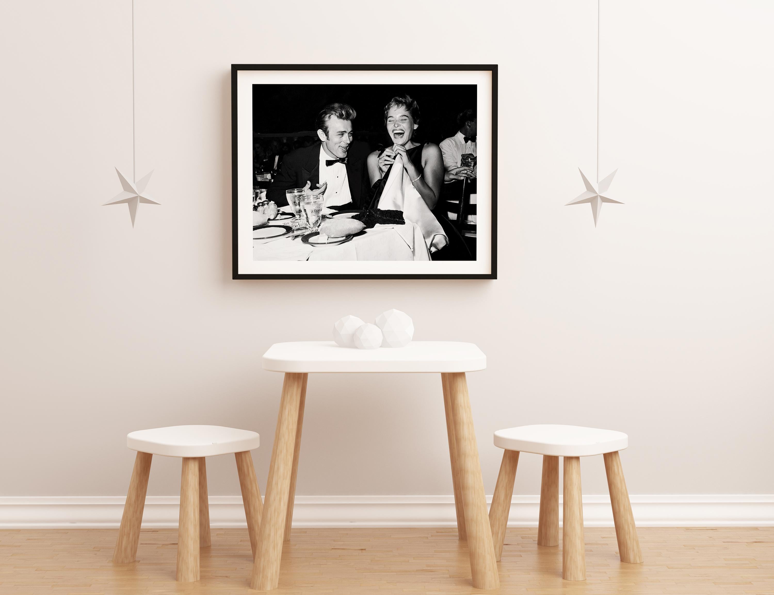 James Dean and Ursula Andress Laughing at Dinner Globe Photos Fine Art Print - Black Black and White Photograph by Unknown