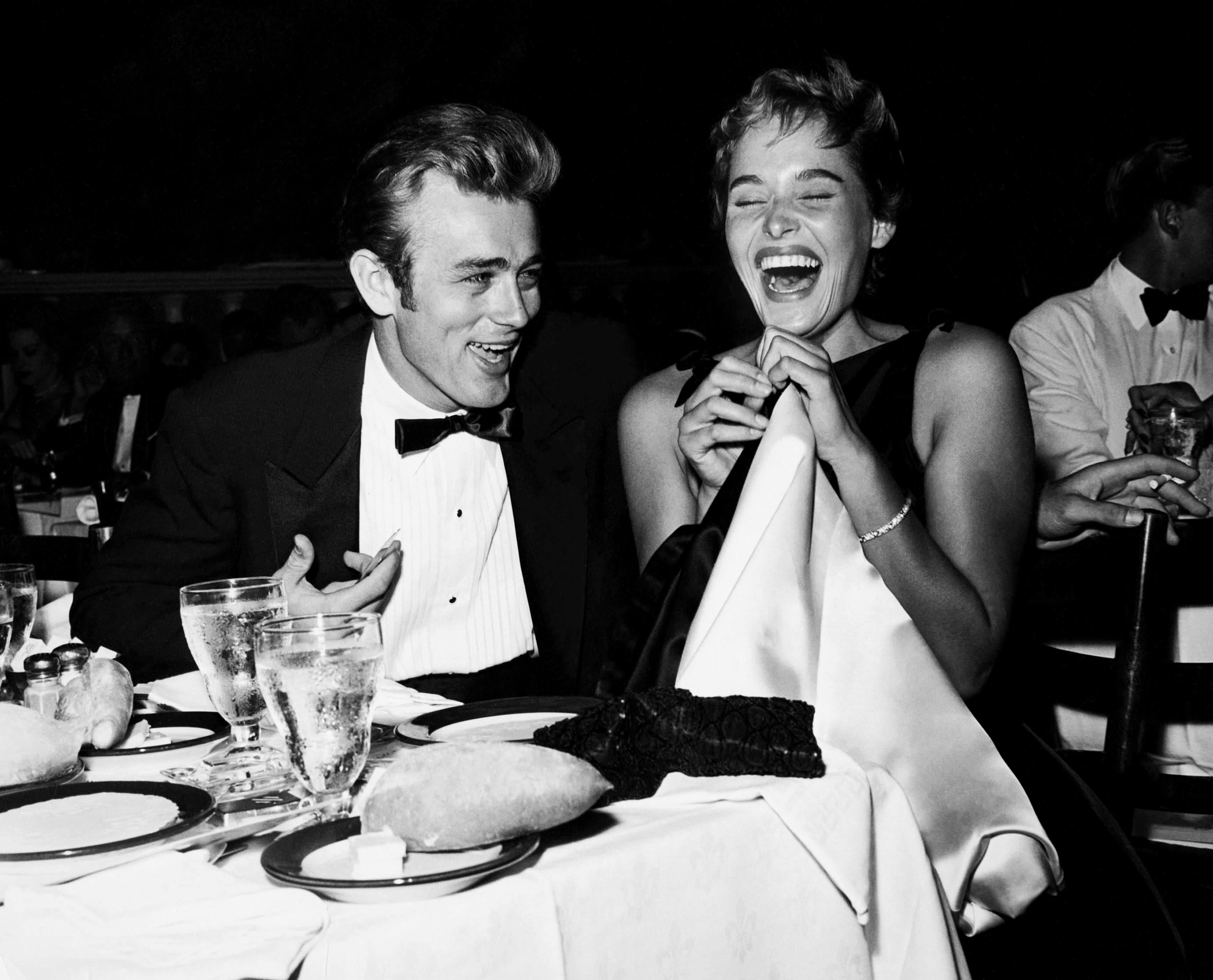 Unknown Black and White Photograph - James Dean and Ursula Andress Laughing at Dinner Globe Photos Fine Art Print