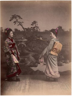 Antique Japan – Two young women playing hanetsuki (badminton) – Hand-colored photograph