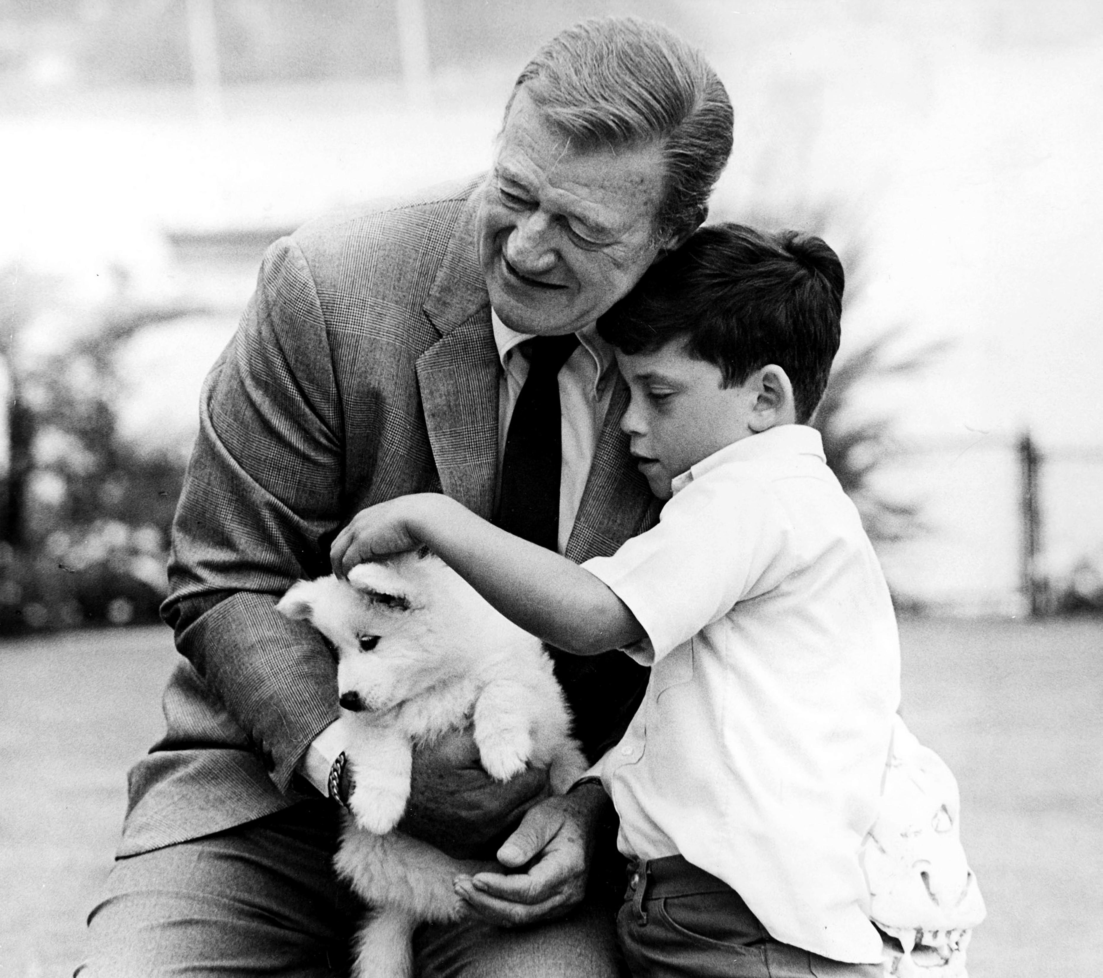 Unknown Portrait Photograph - John and Ethan Wayne with Puppy